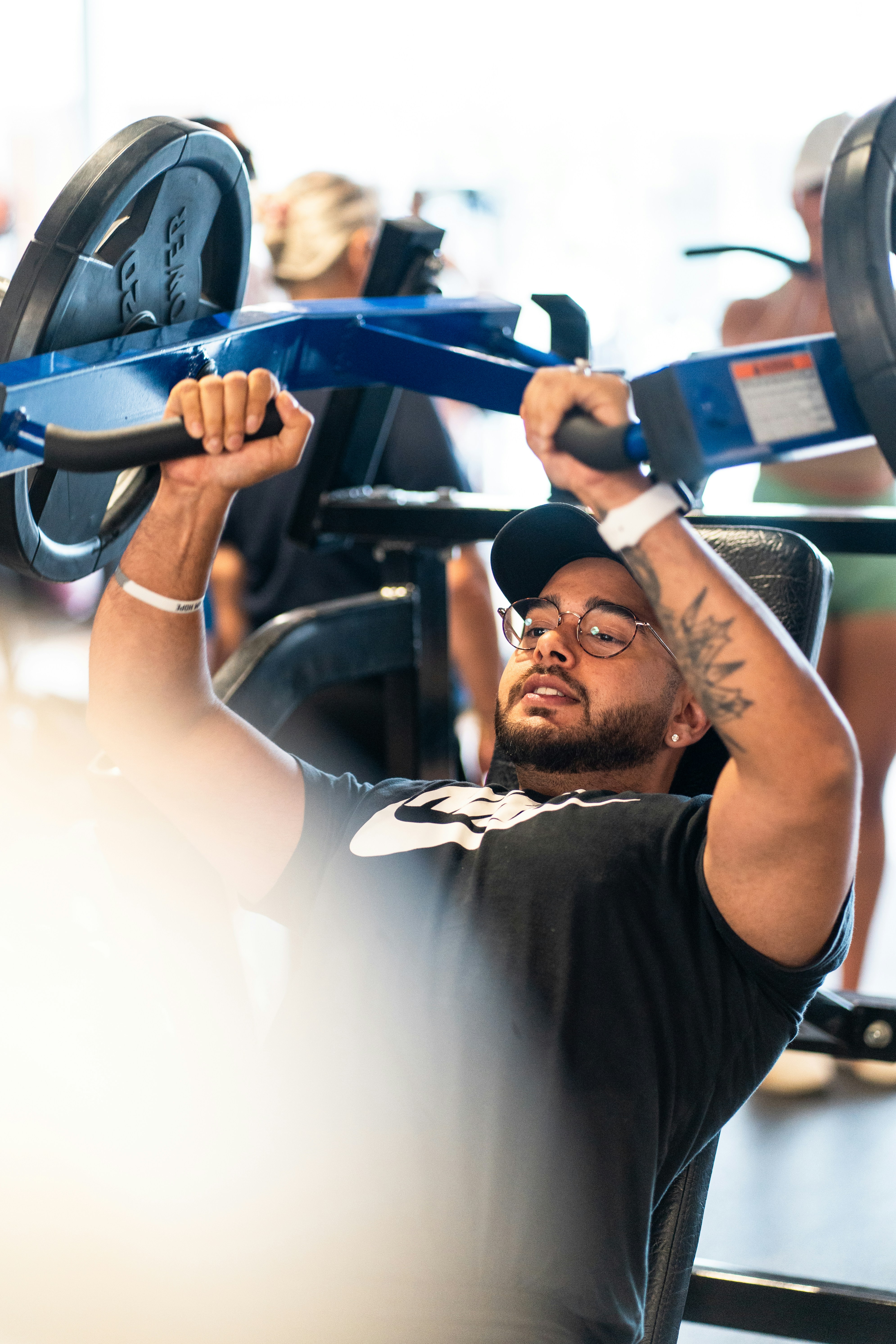 A man doing a bench press with a barbell