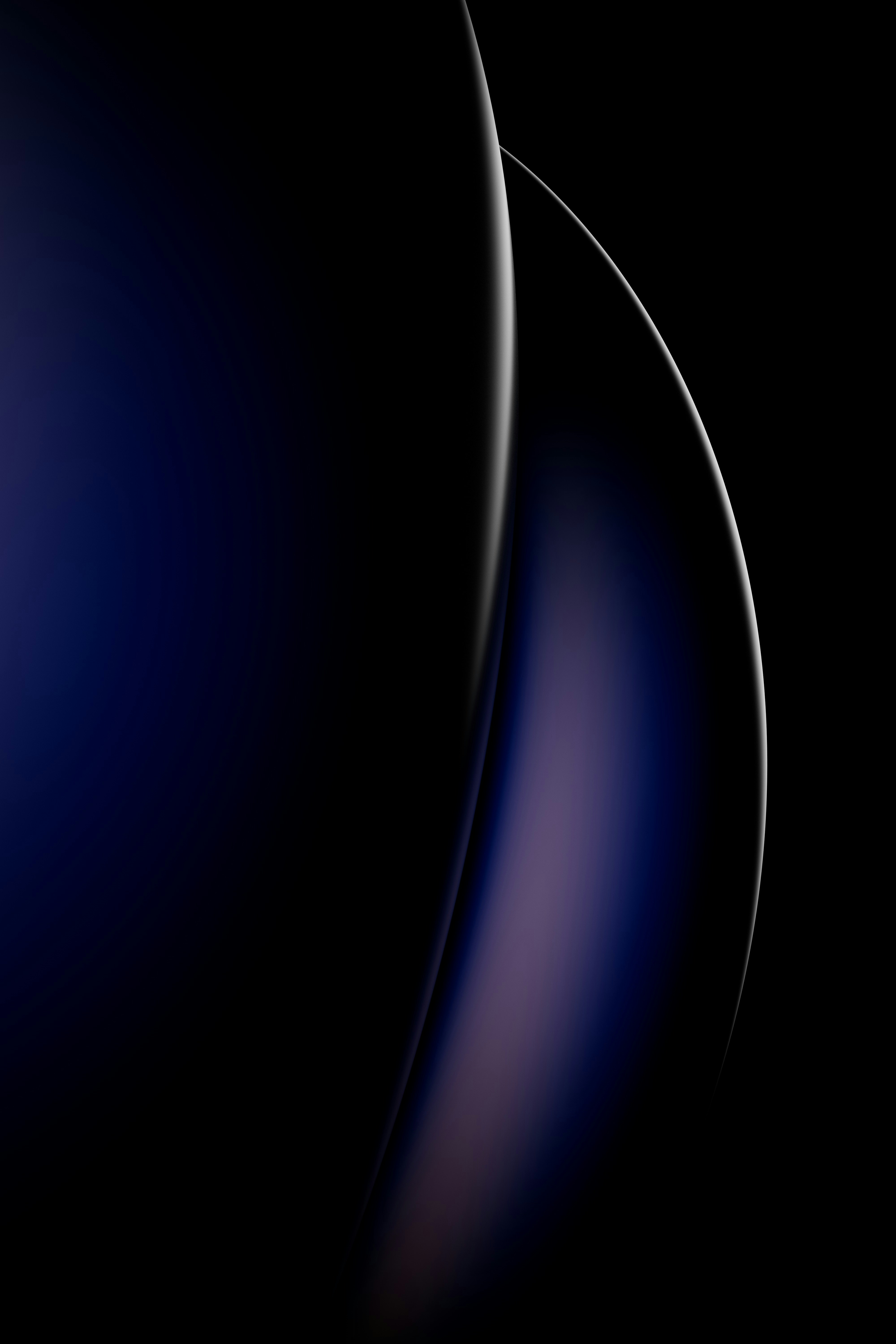 A close up of a blue object on a black background