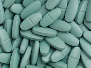 A pile of pills sitting on top of a table