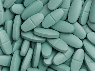 A pile of pills sitting on top of a table