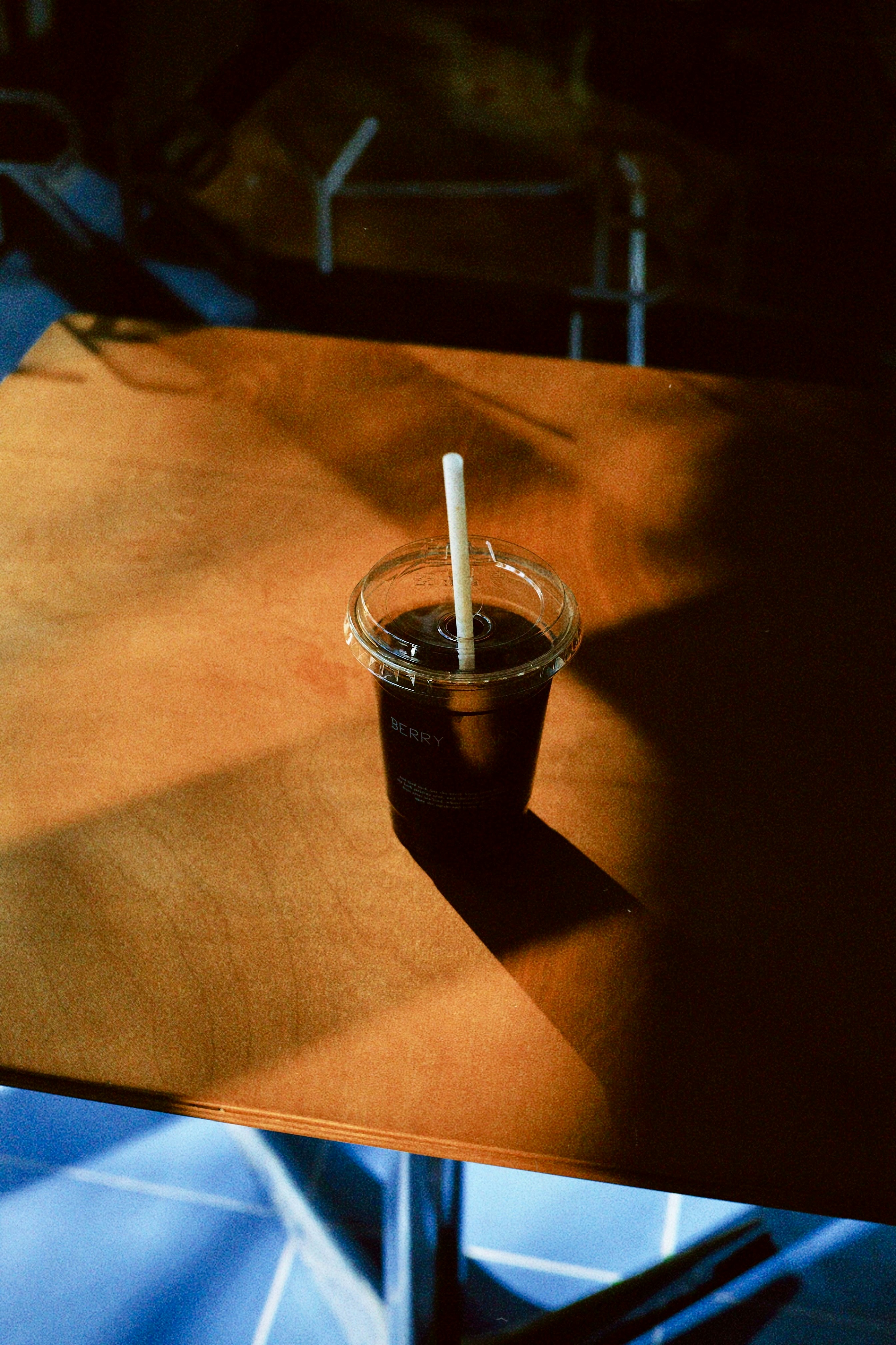 A cup of coffee sitting on top of a wooden table
