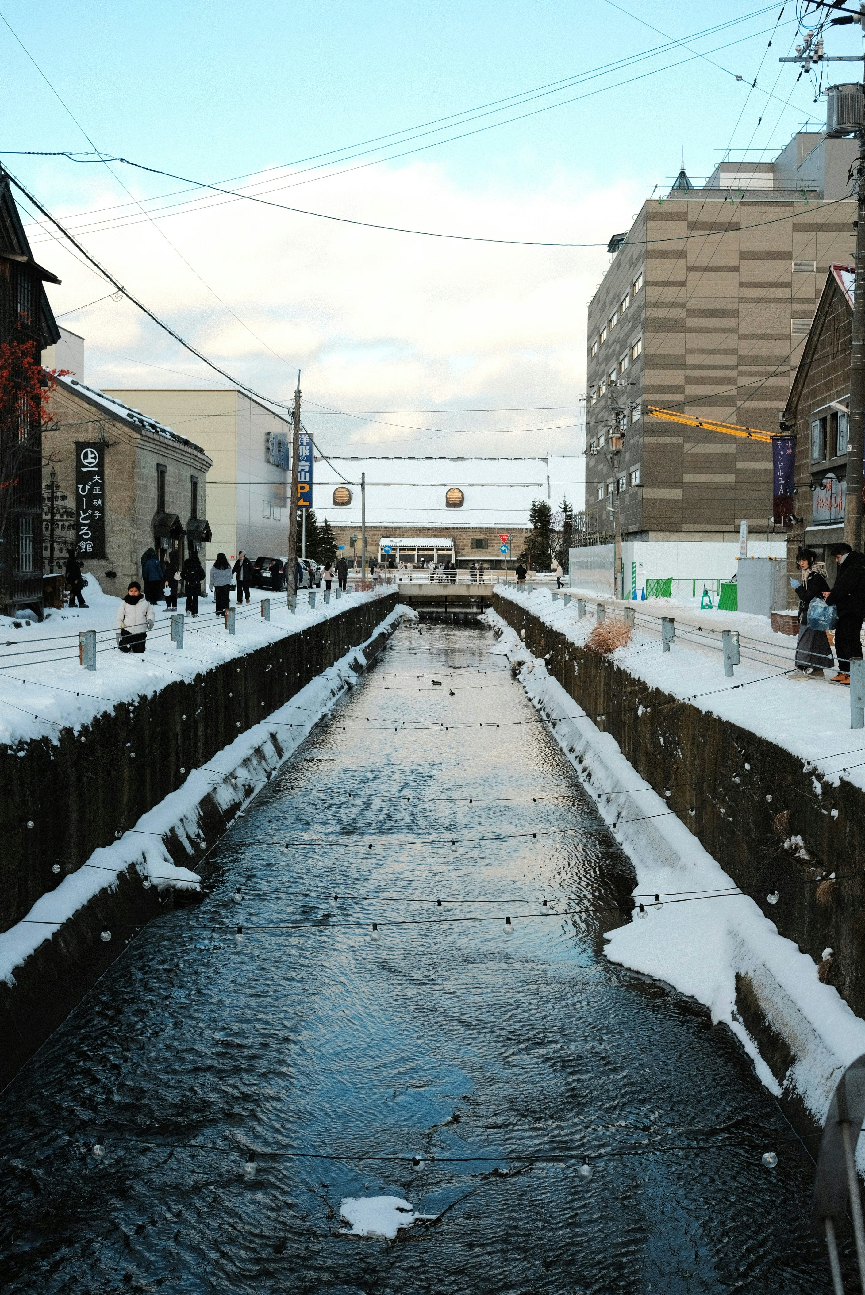 A river running through a city surrounded by tall buildings
