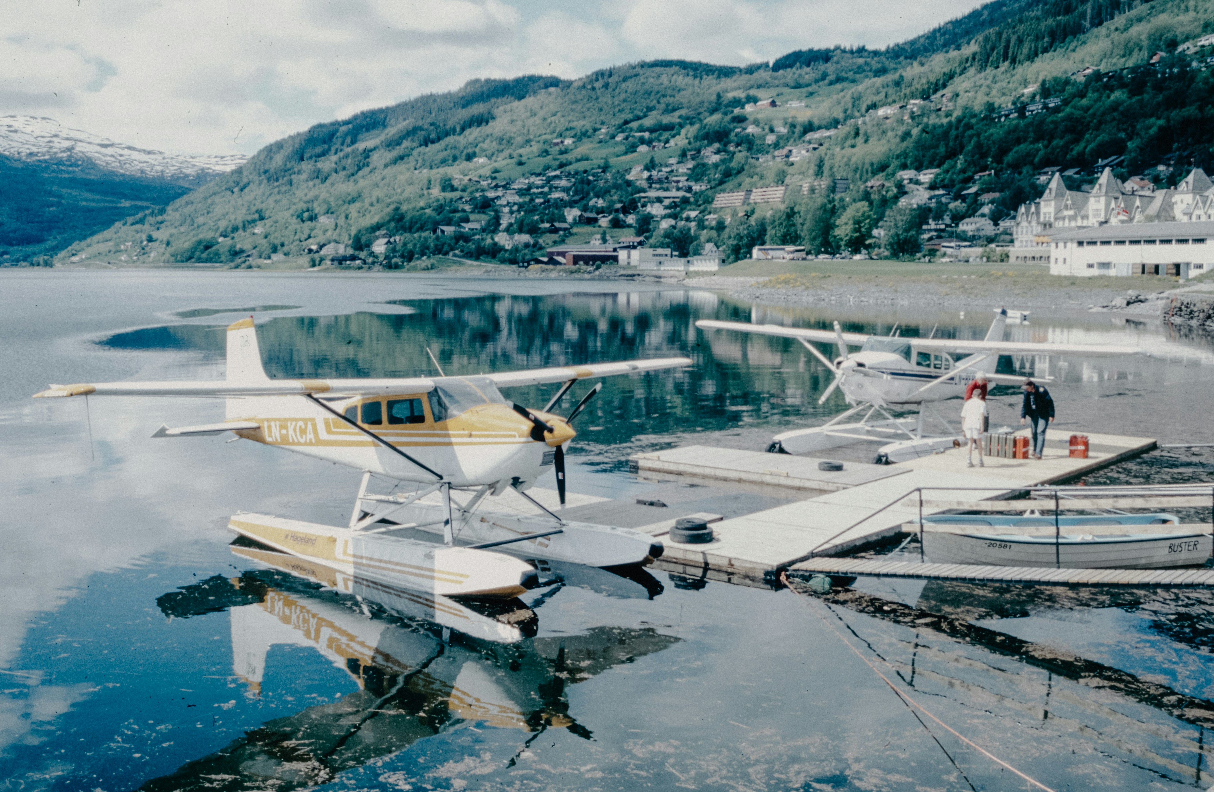 A small plane sitting on top of a body of water
