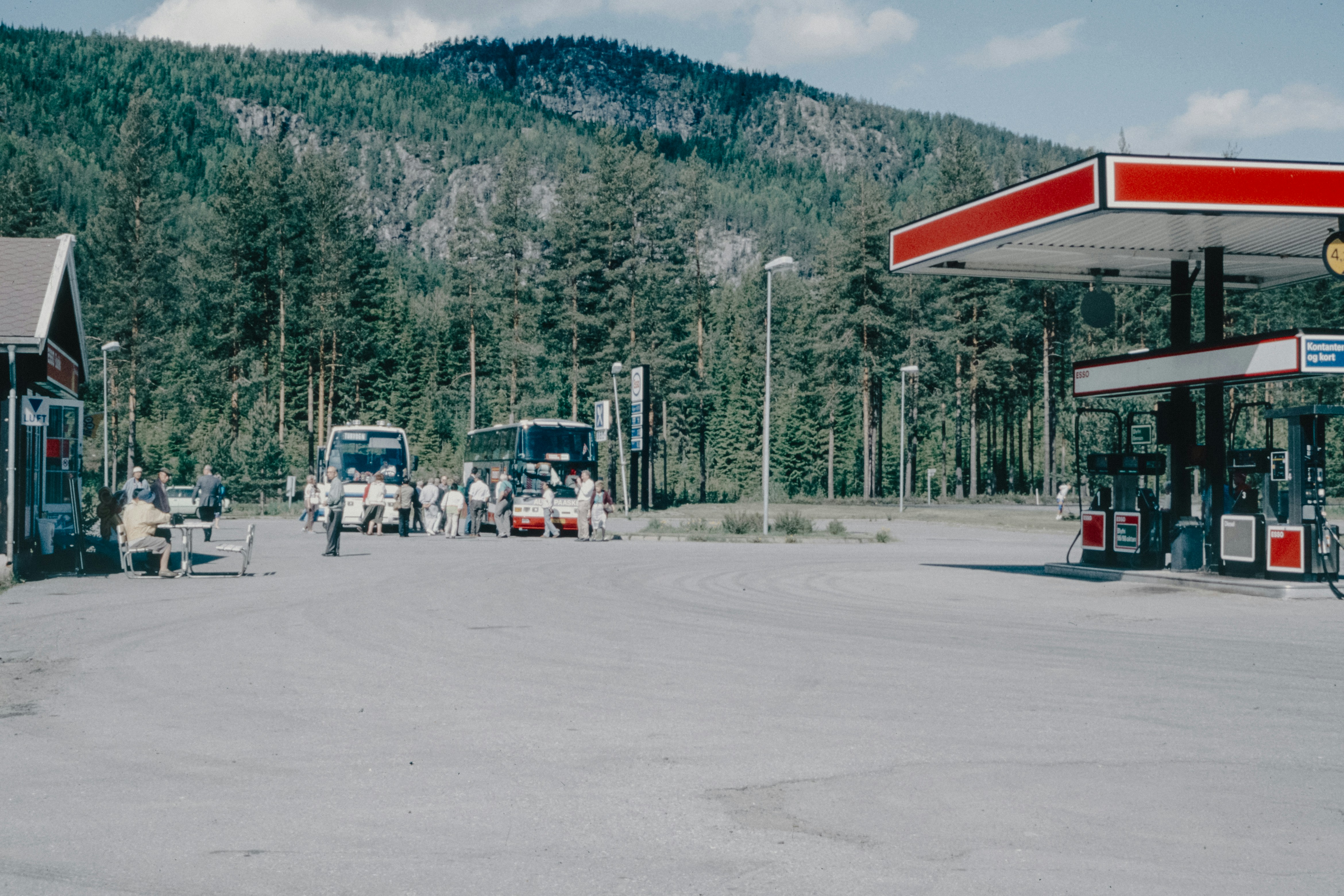 A gas station with a mountain in the background