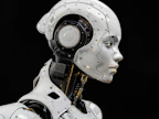 A white robot is standing in front of a black background