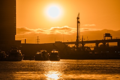 A large body of water with a sunset in the background