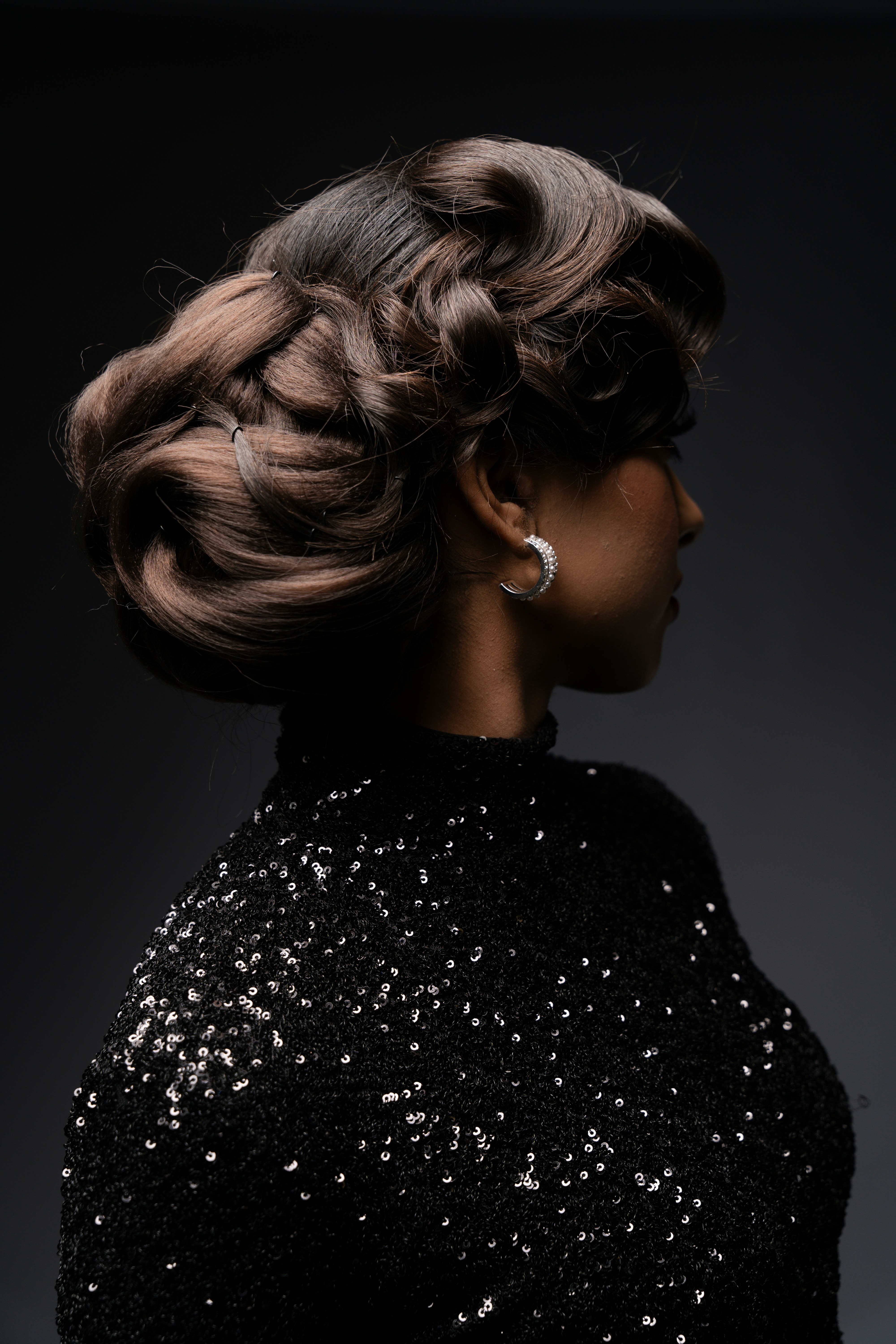 A woman in a black dress with a braid in her hair photo – Free Modern ...