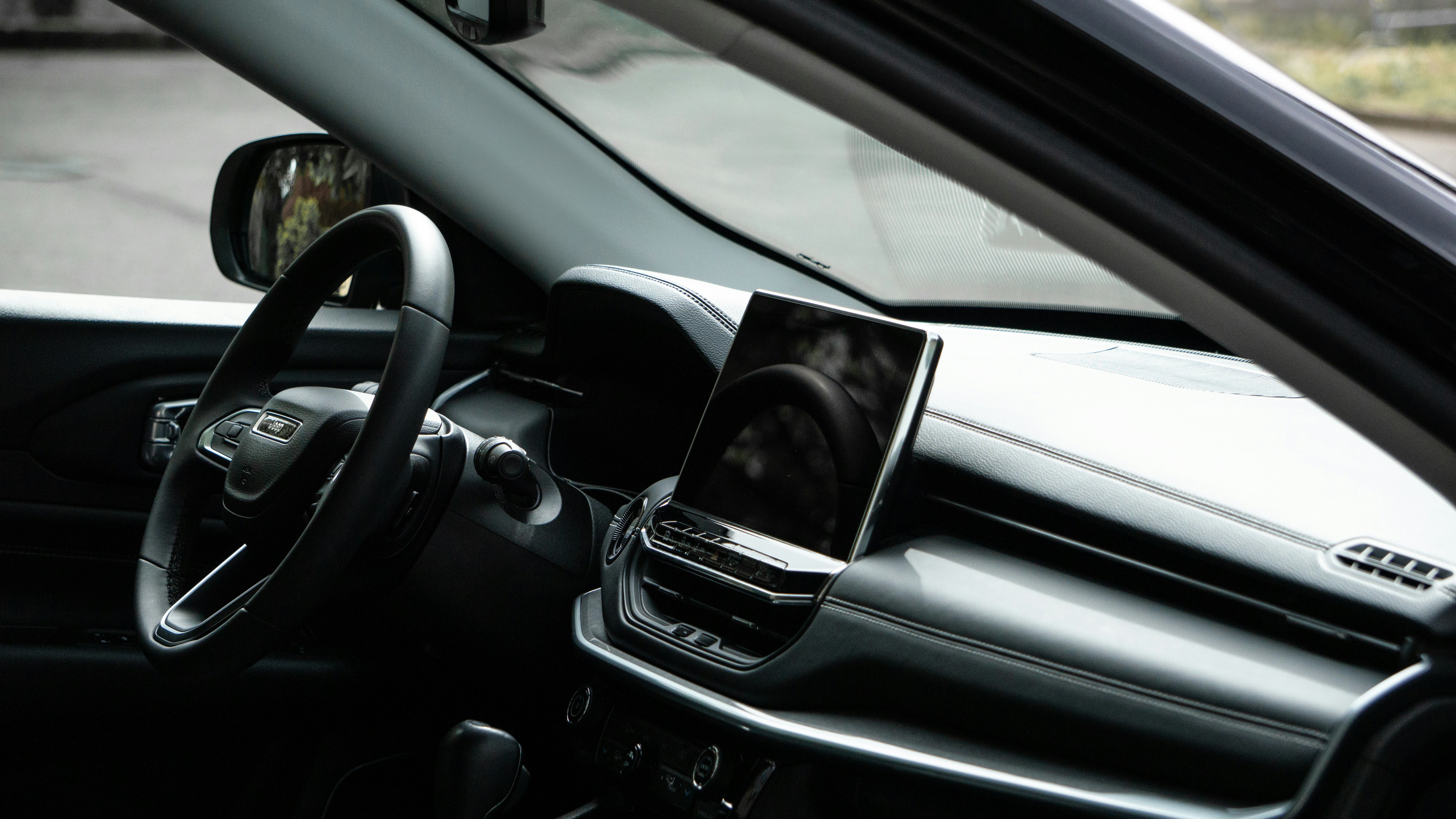 A view of a car dashboard with a dash camera