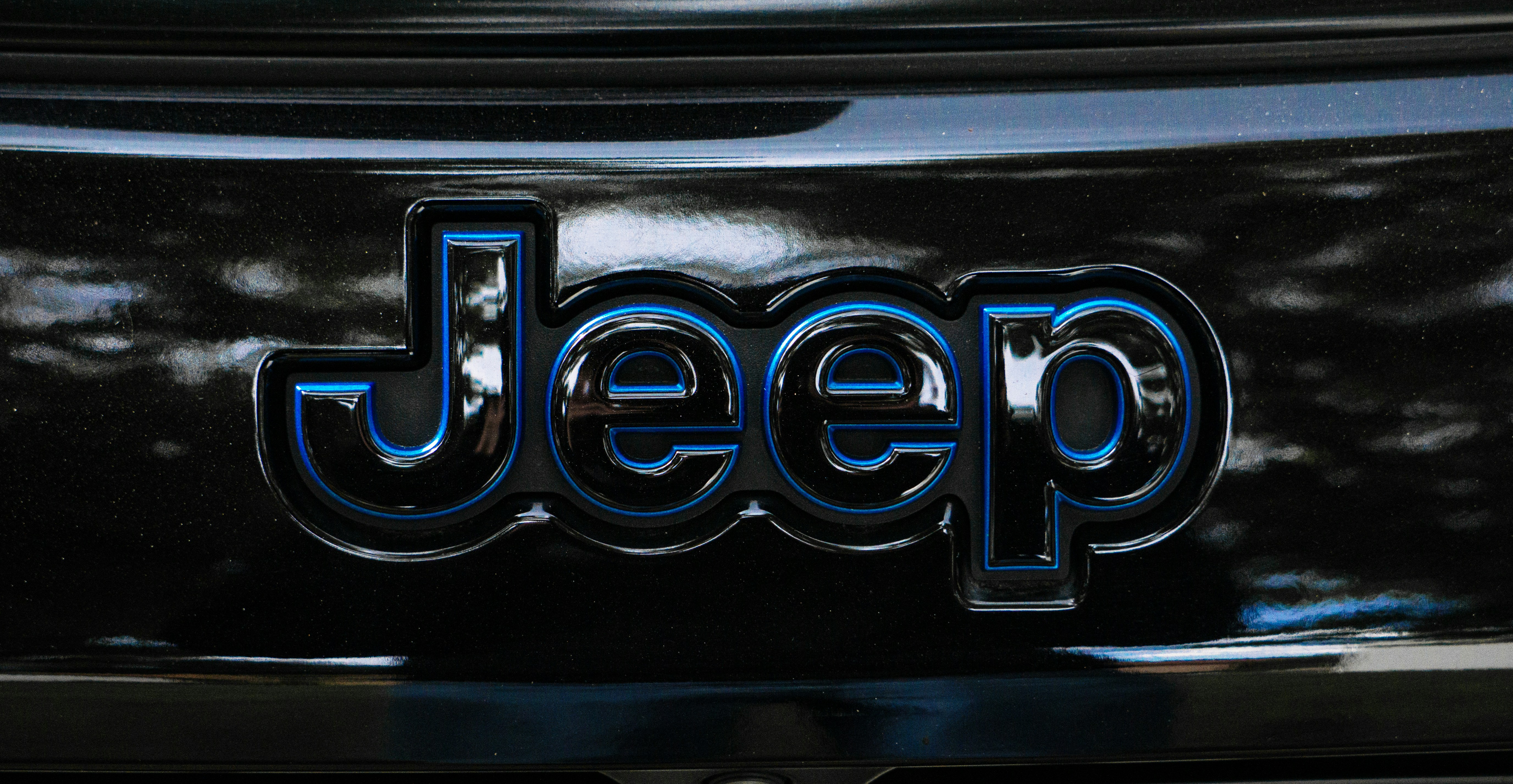 A close up of a jeep emblem on a car