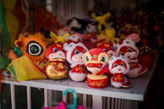 A bunch of stuffed animals sitting on a shelf