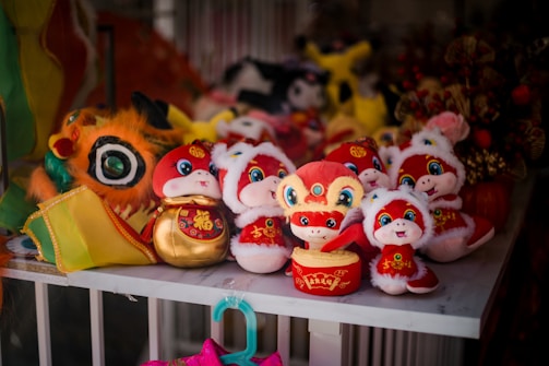 A bunch of stuffed animals sitting on a shelf