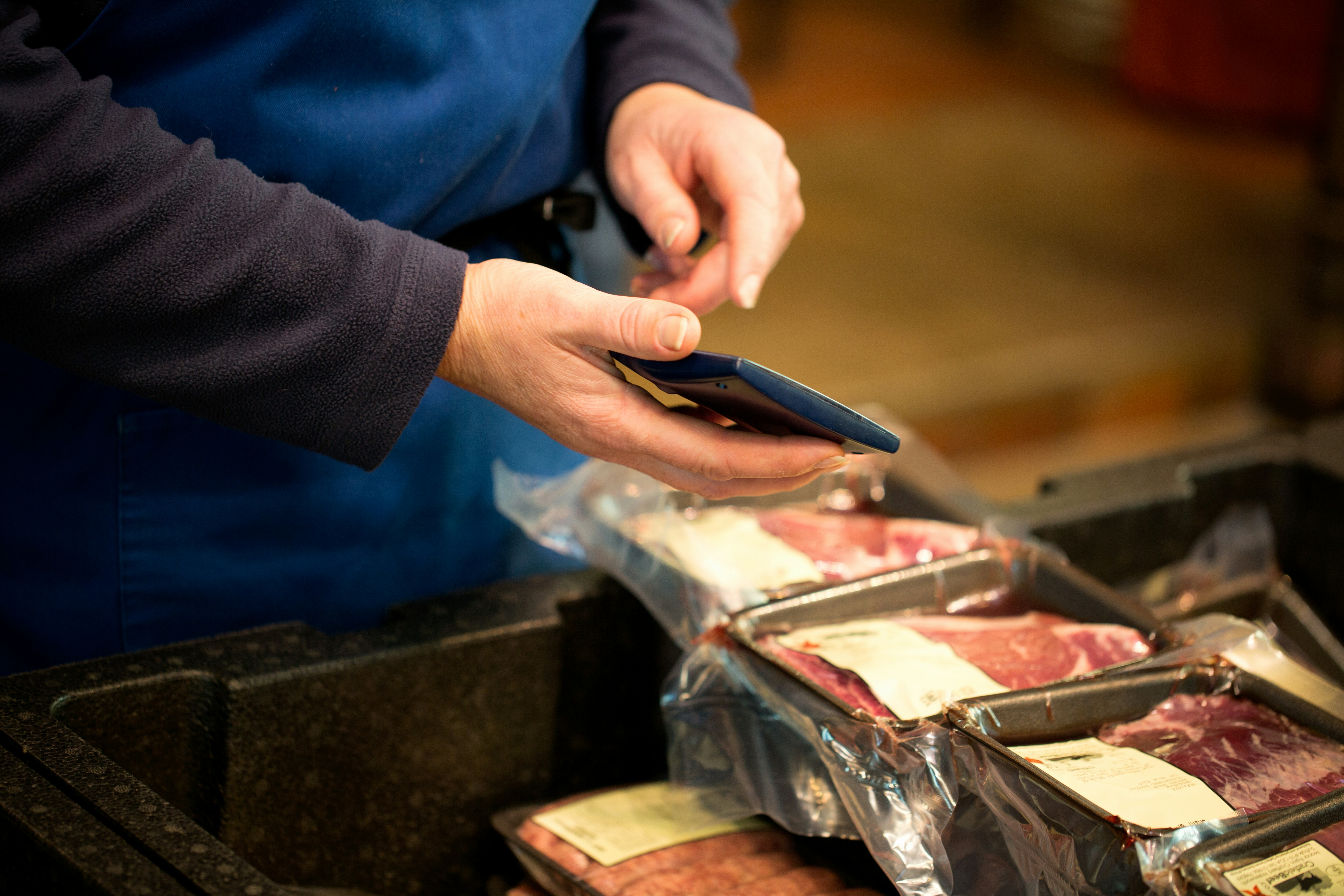 A person holding a cell phone in their hand