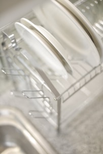 A close up of a dish rack in a kitchen