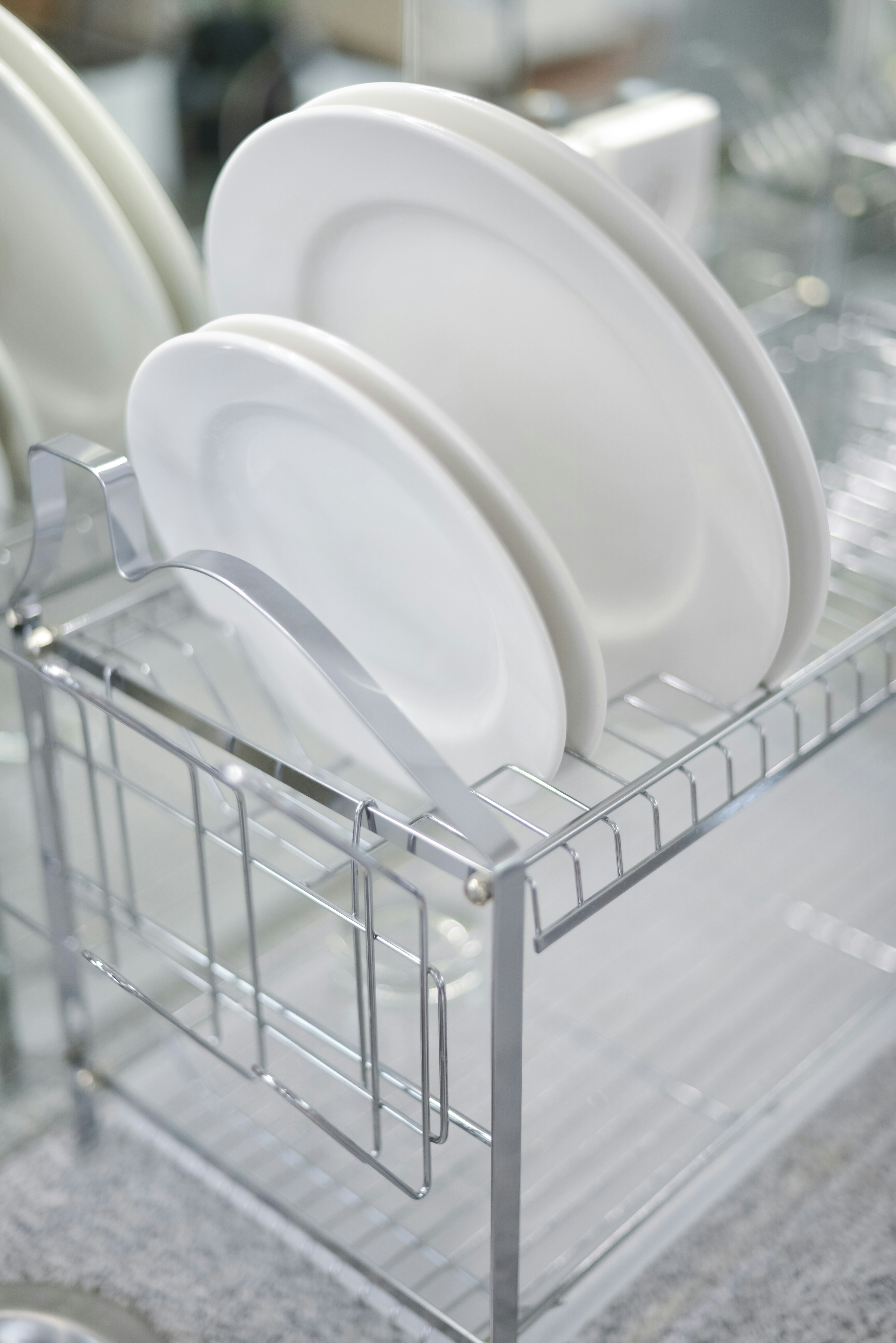 A rack with plates and cups in it