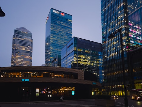 A view of some very tall buildings at night