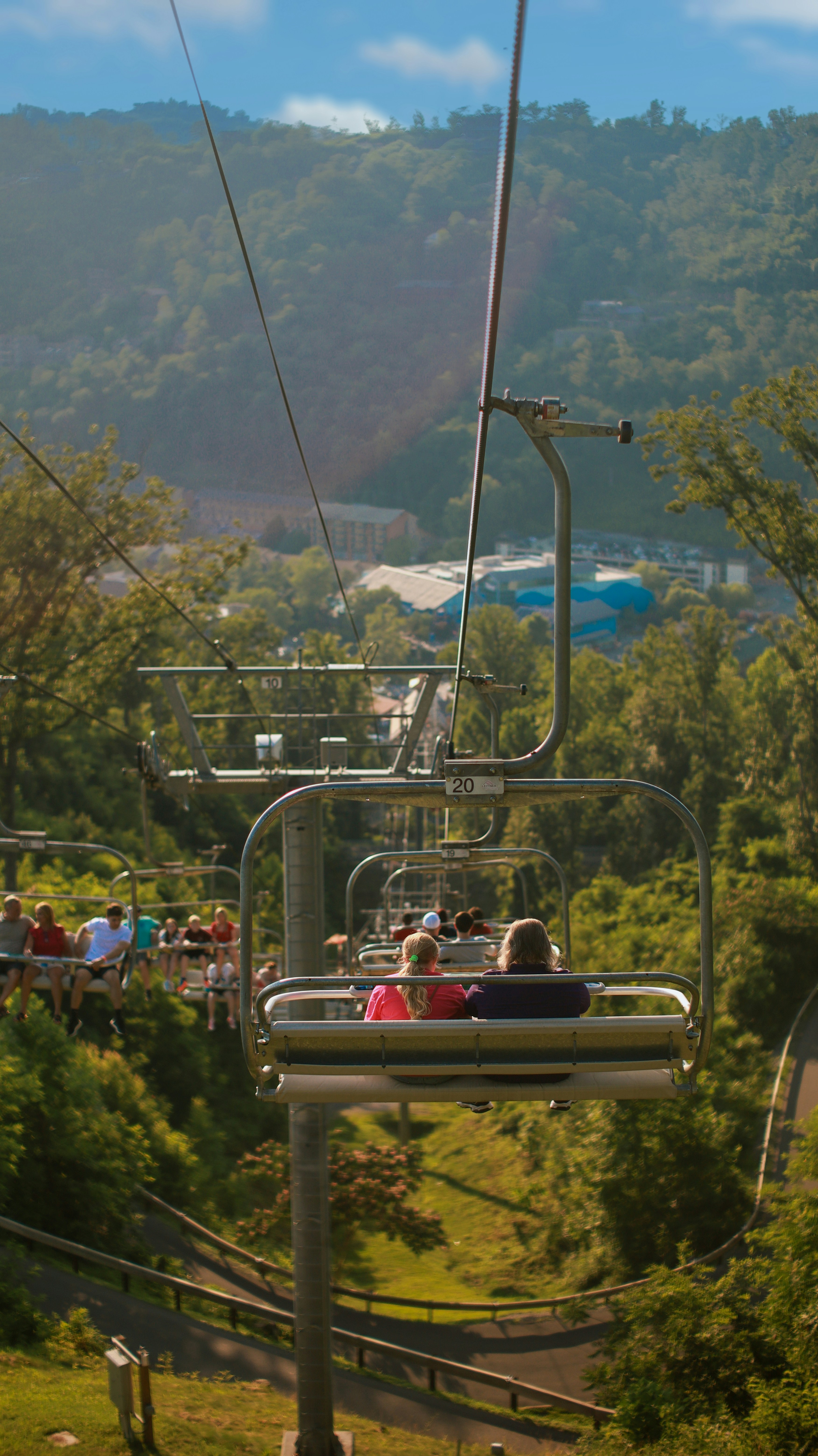 A group of people riding a ski lift