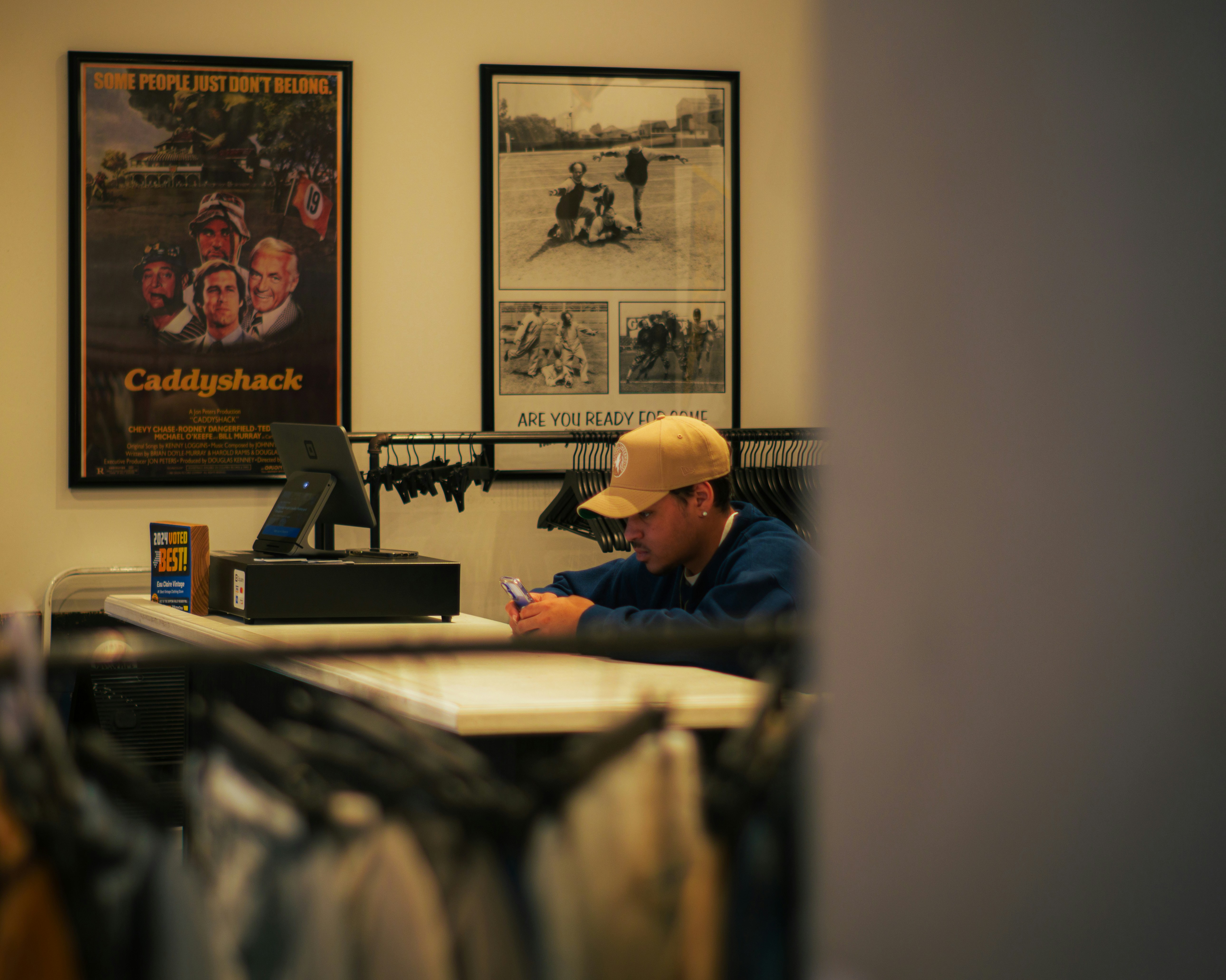 A man sitting at a desk in a store