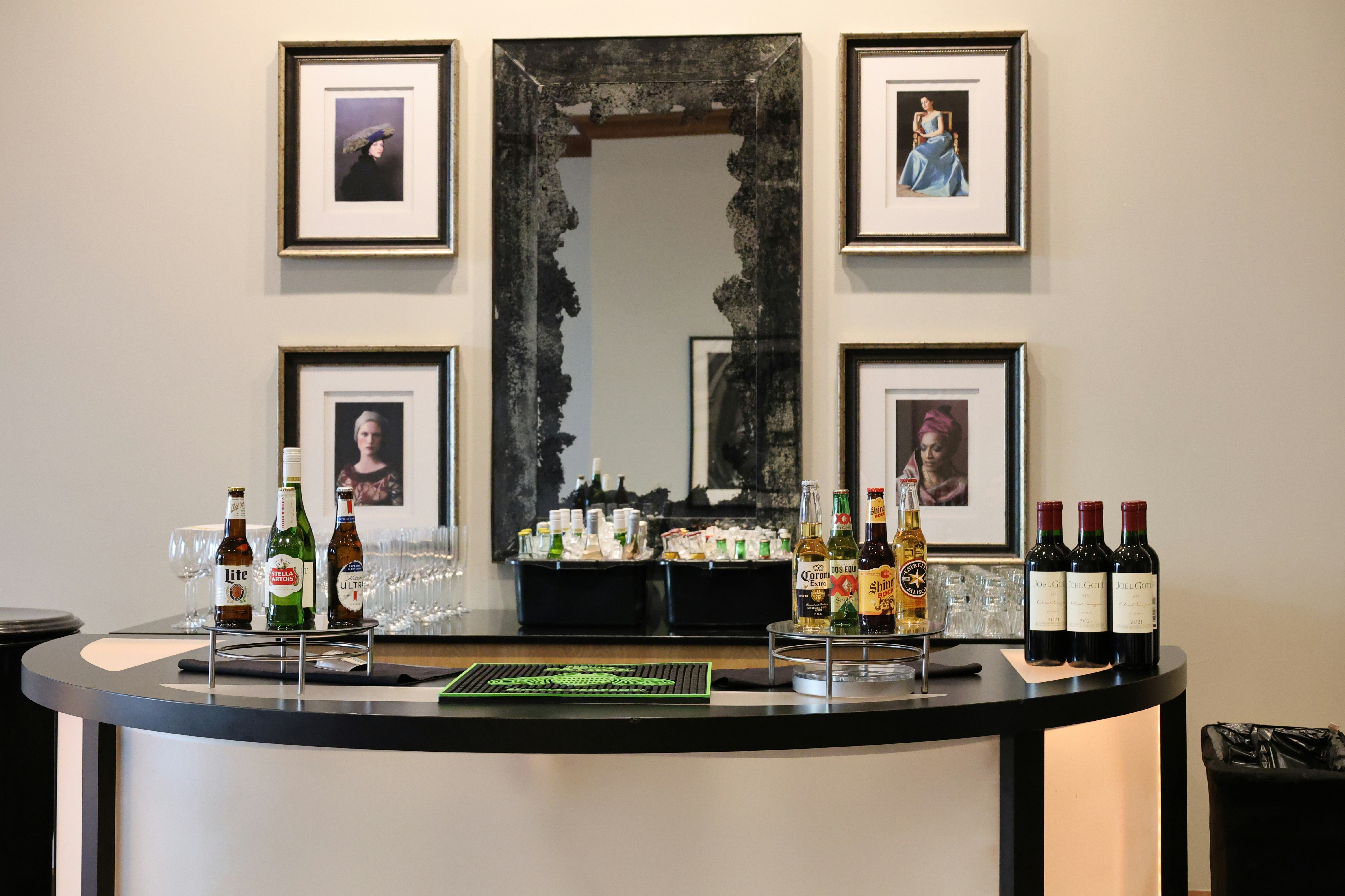 A bar with several bottles of alcohol on it