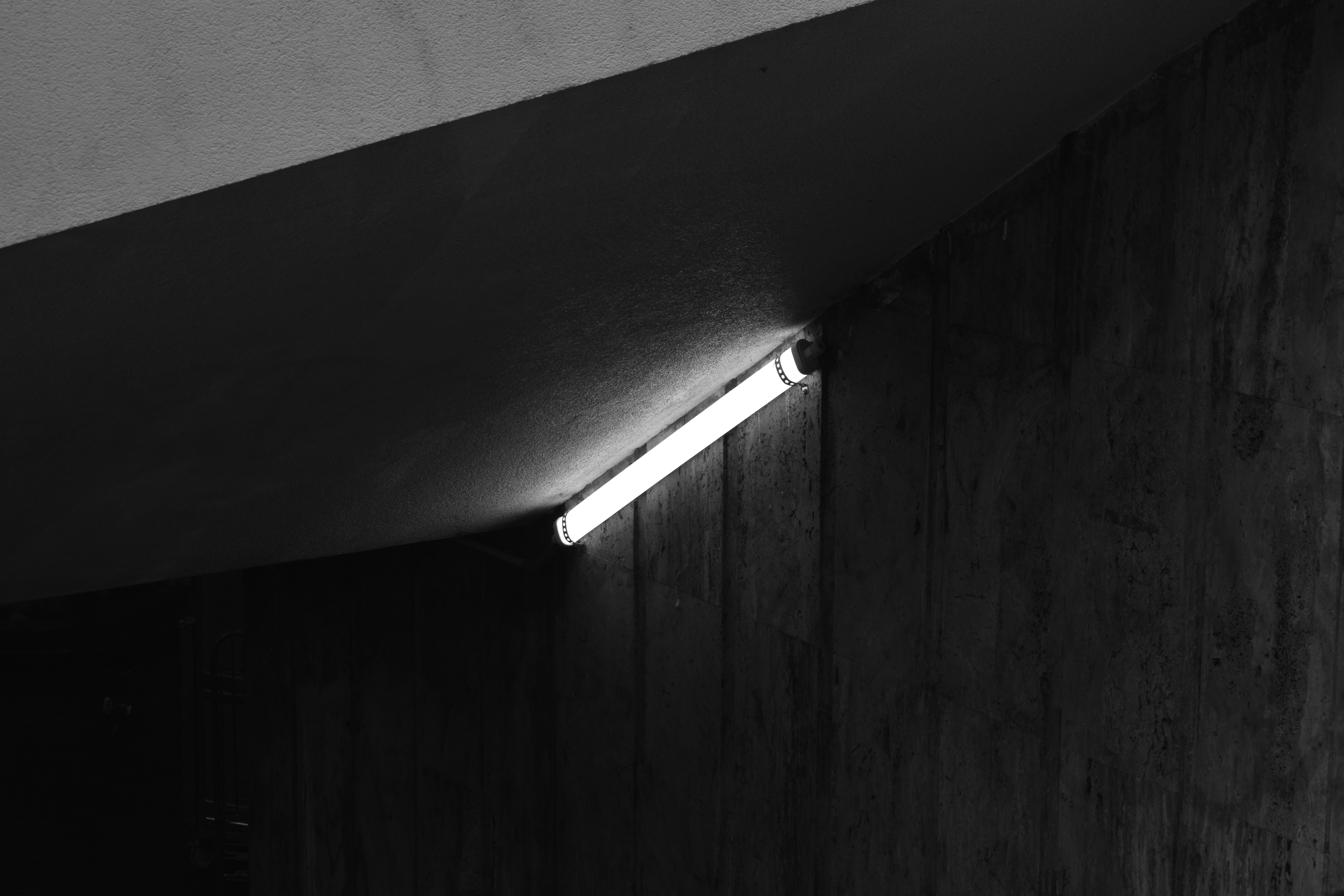 Close-up of AA batteries being inserted into a game controller in a modern home