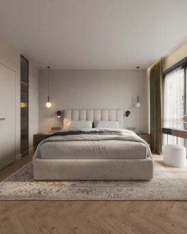 A bedroom with a large bed and a large window