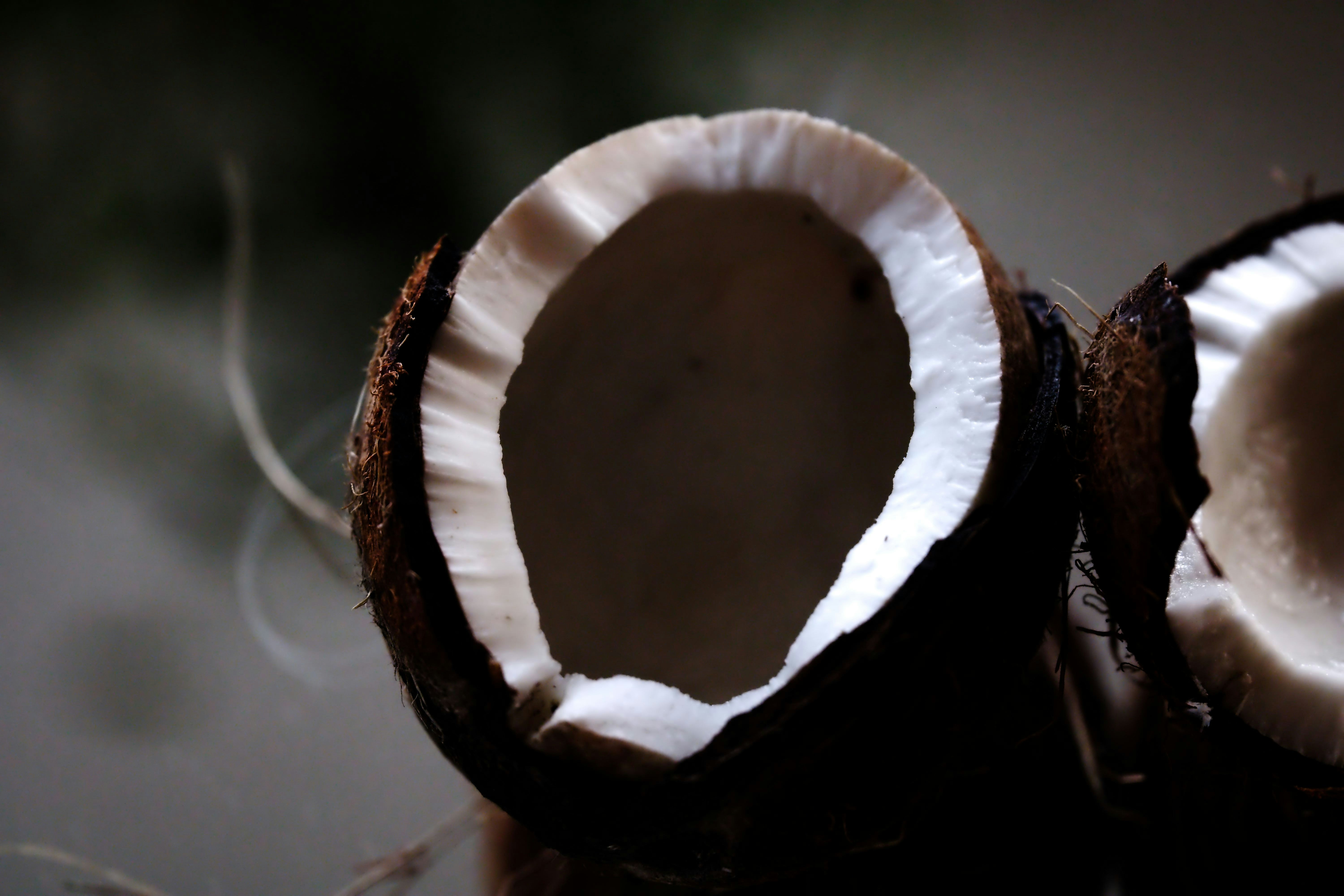 A close up of a sliced coconut on a table