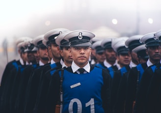 A group of uniformed men standing next to each other