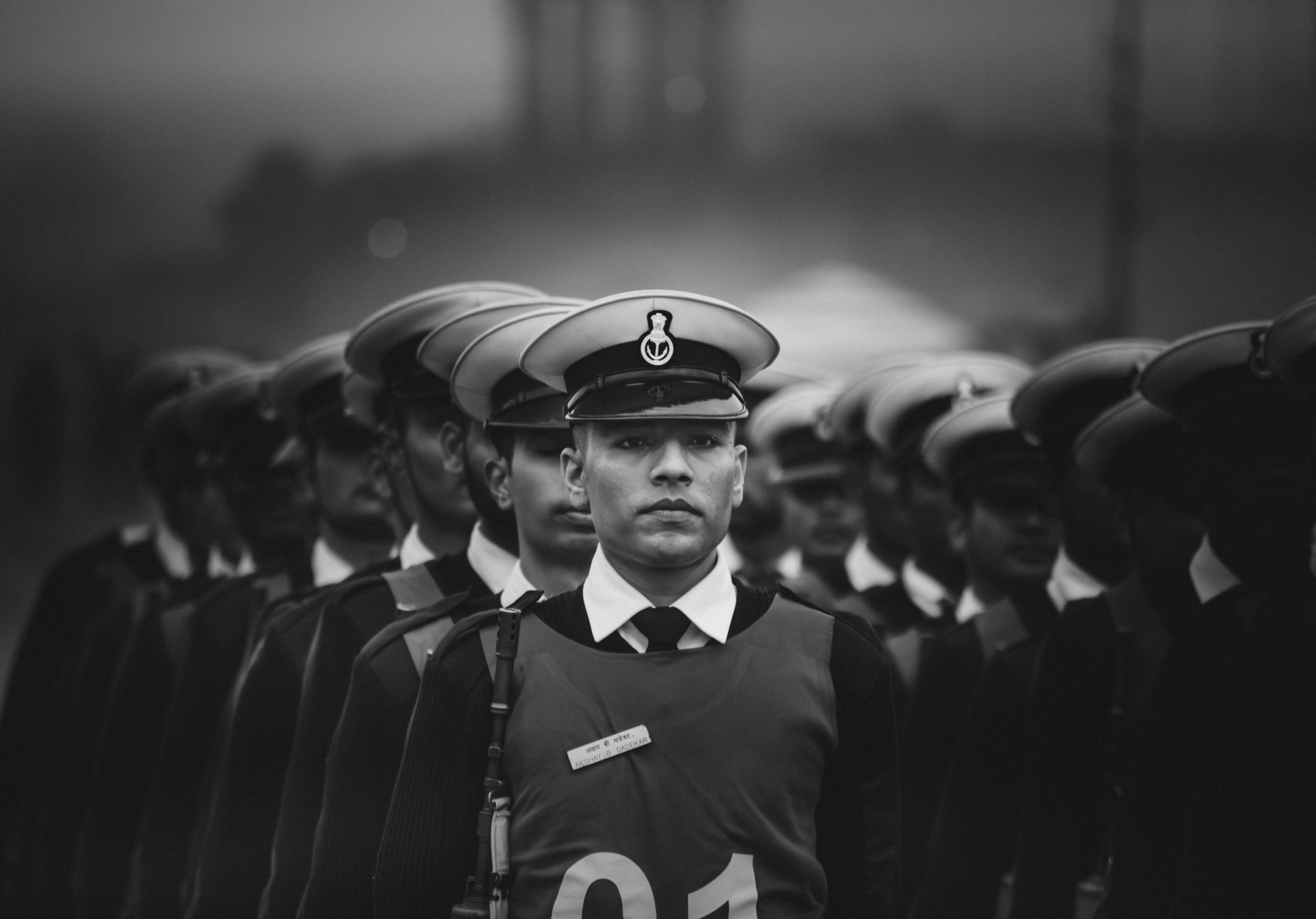 A black and white photo of a man in uniform