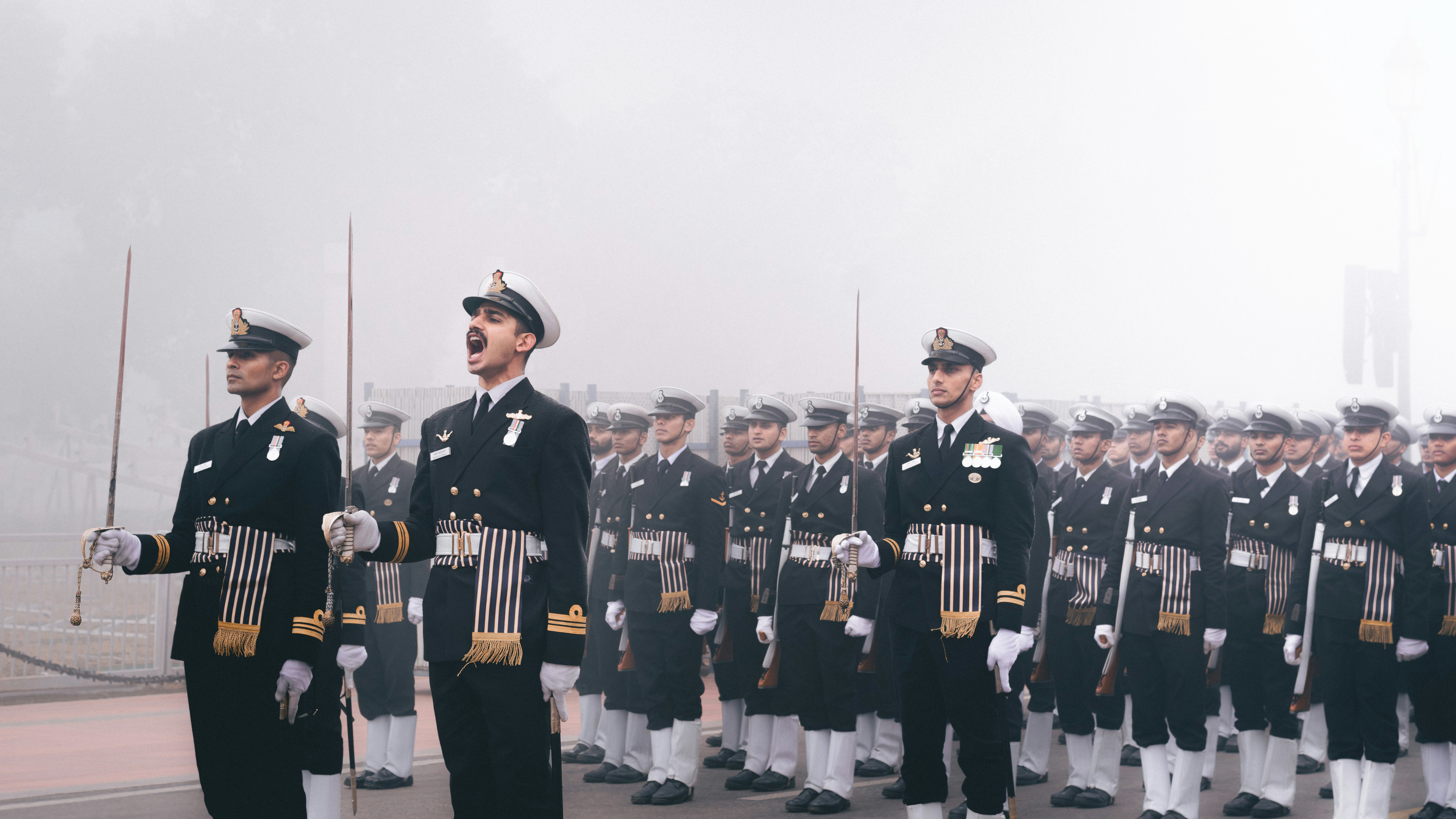 A group of men in uniform standing in front of each other