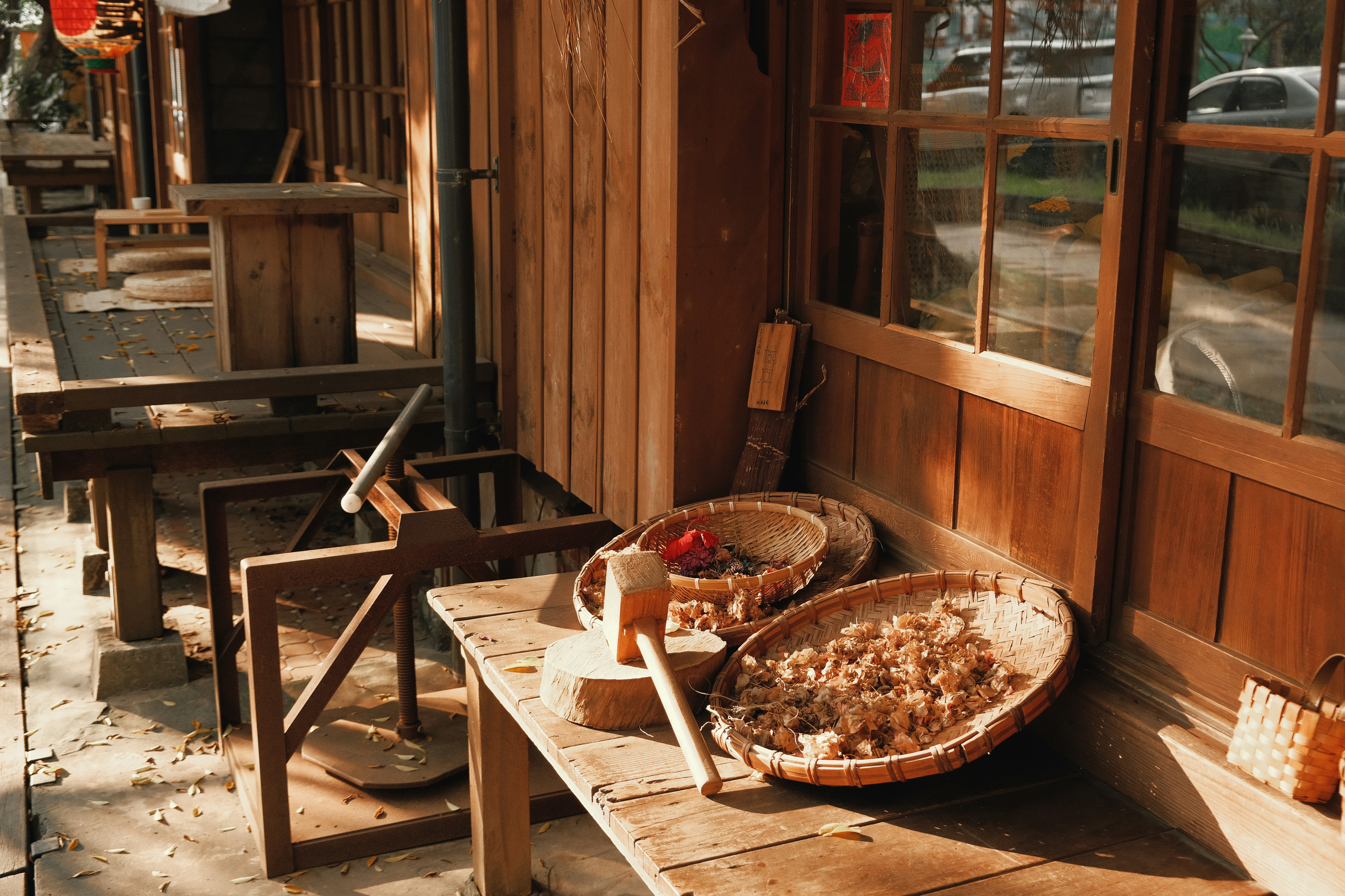 A wooden bench sitting outside of a building