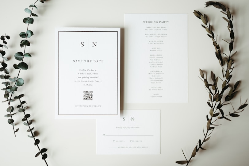 A couple of cards and some flowers on a table