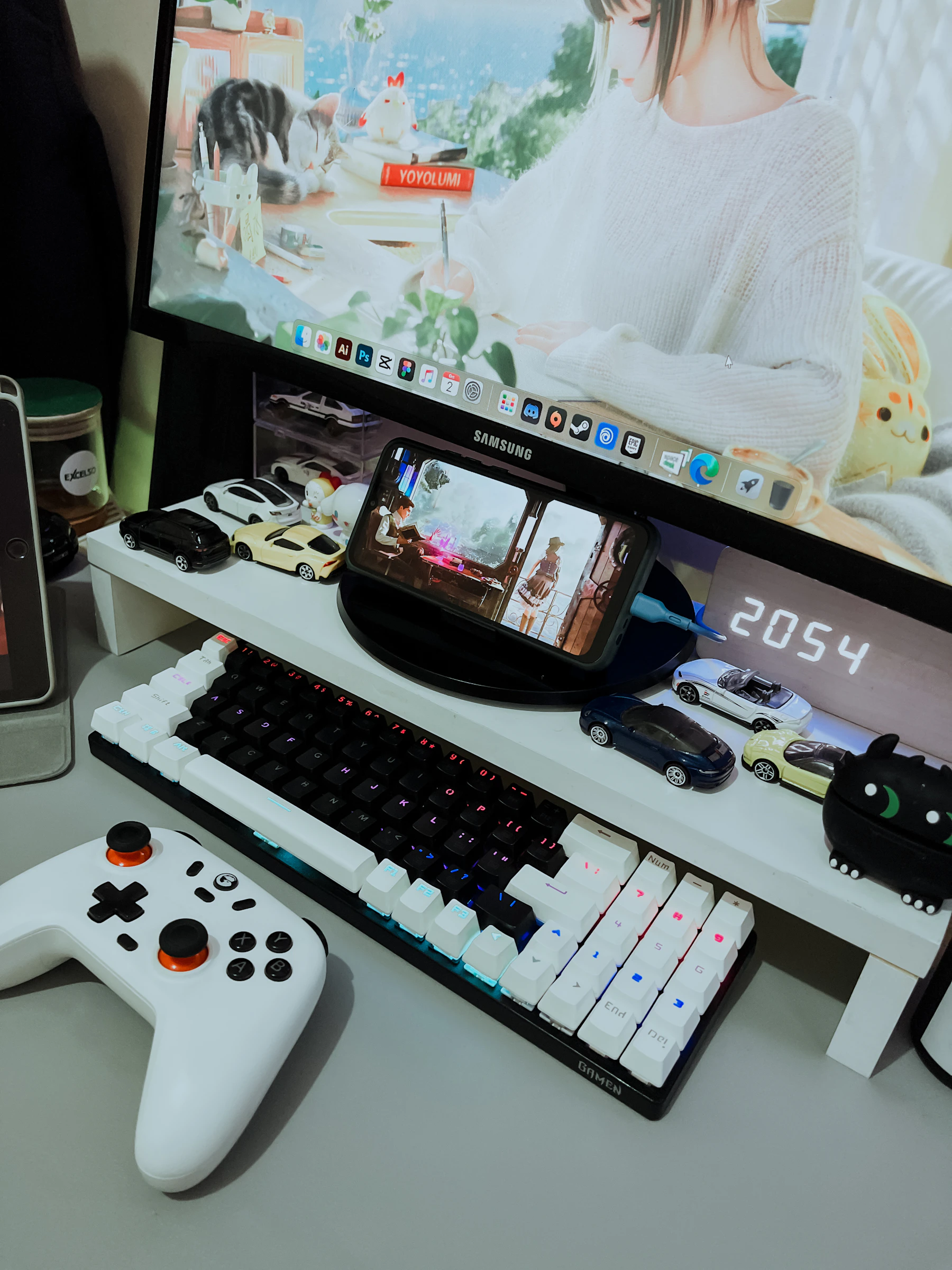Controller beside a mechanical keyboard in a modern gaming desk setup