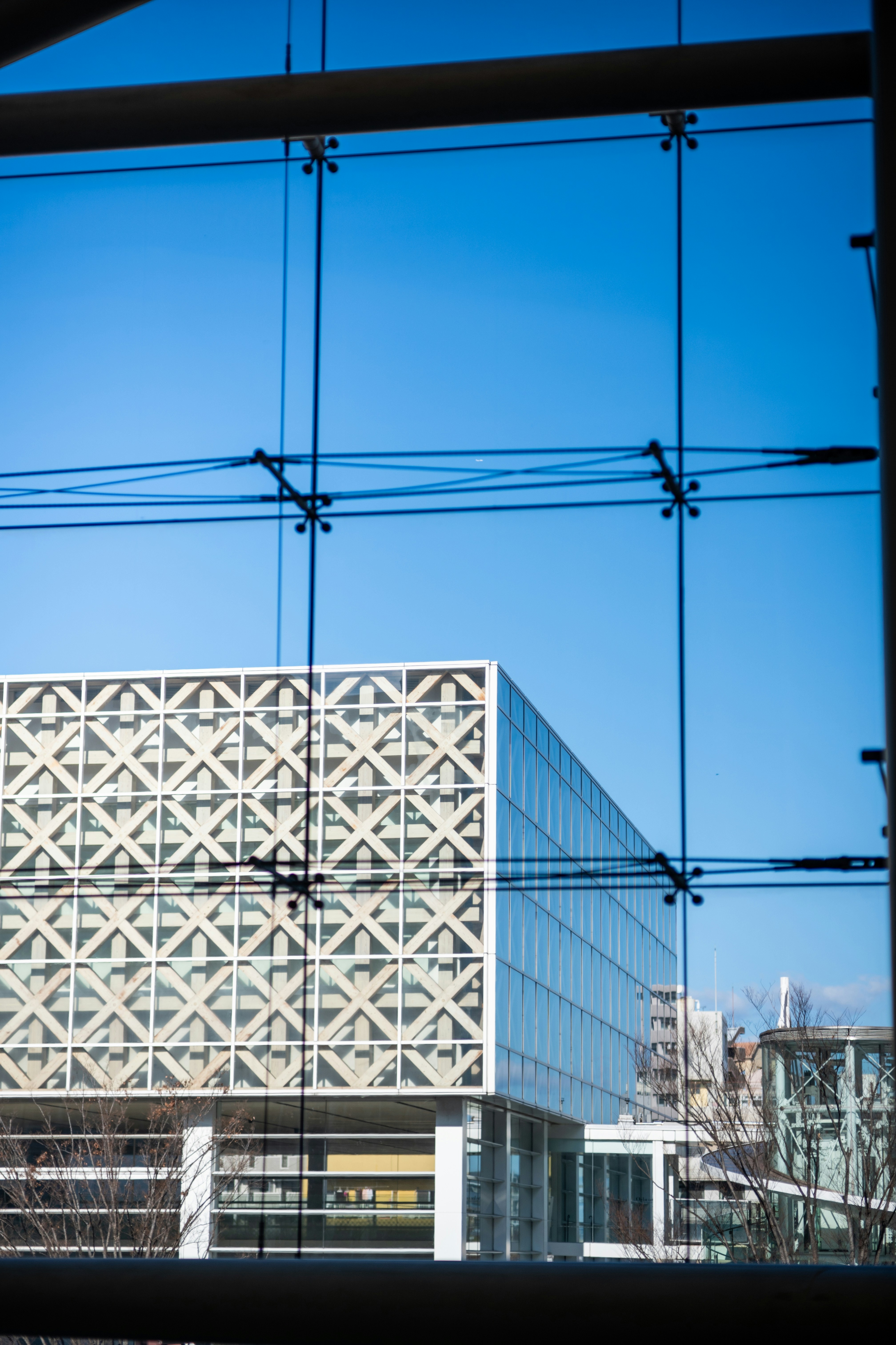 A view of a building through a window photo – Free Building Image on ...