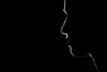 A silhouette of a person in the dark
