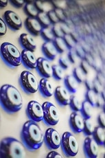 A close up of a bunch of blue glass eyes
