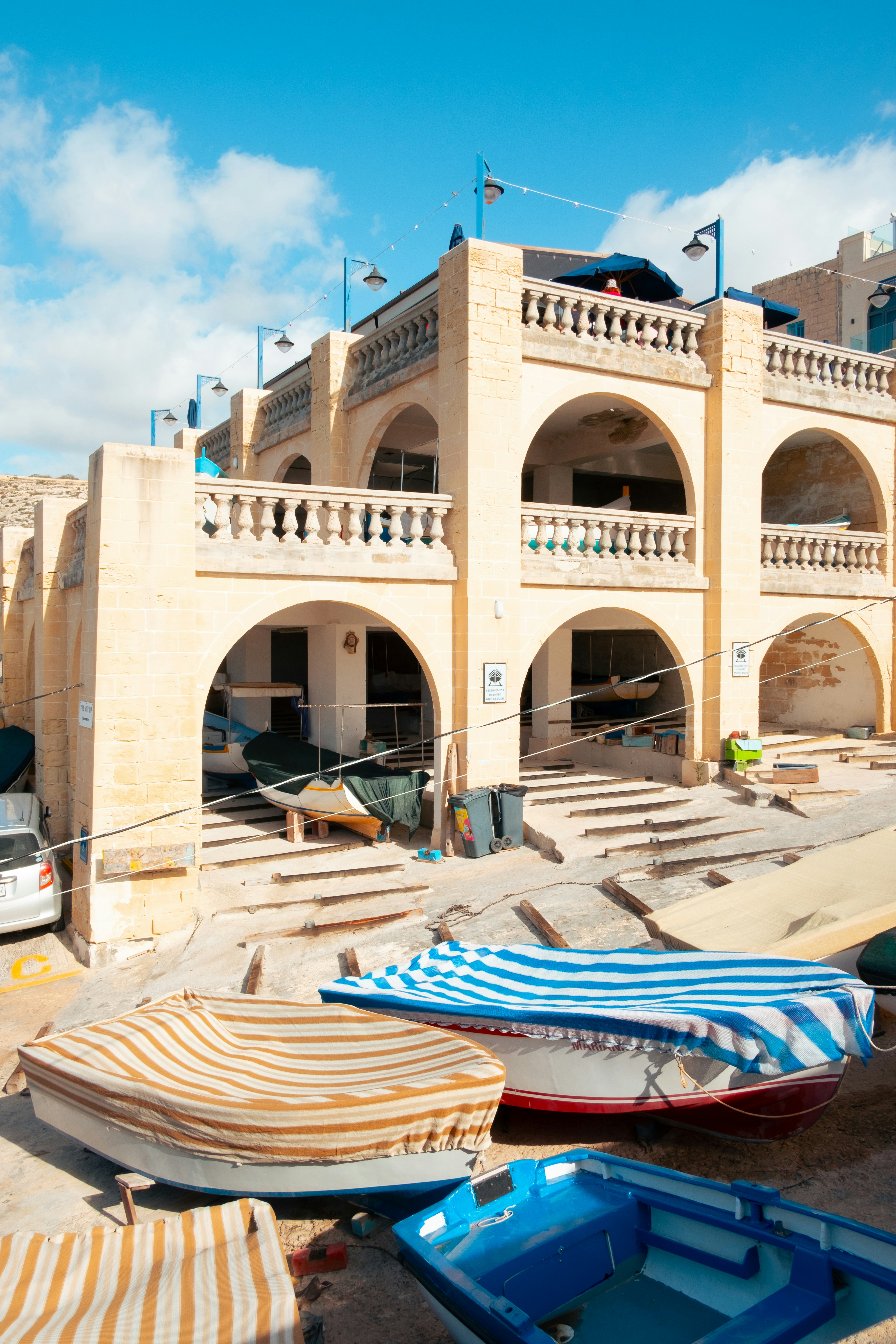 A group of boats sitting in front of a building