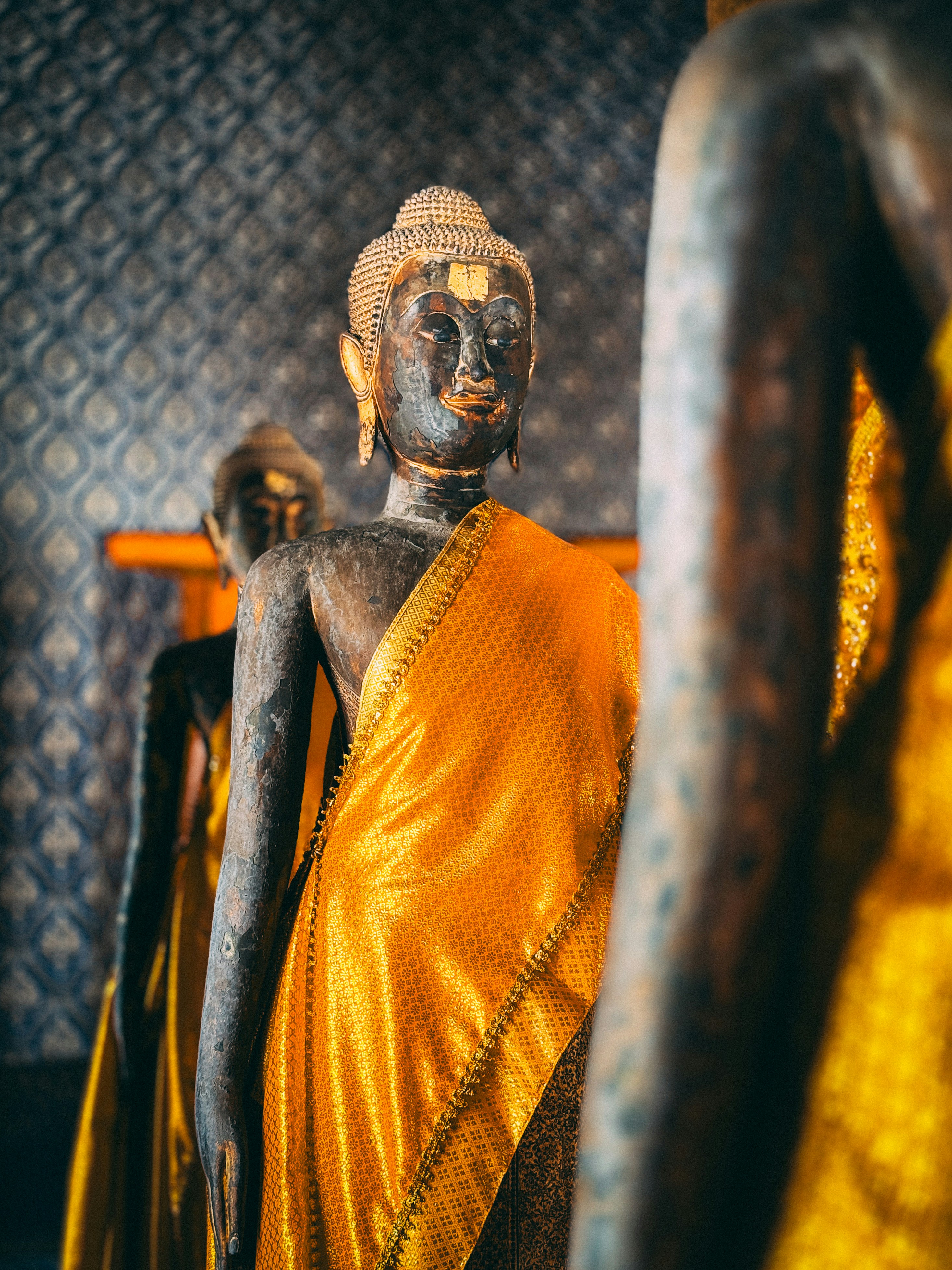 A statue of a person in a yellow dress