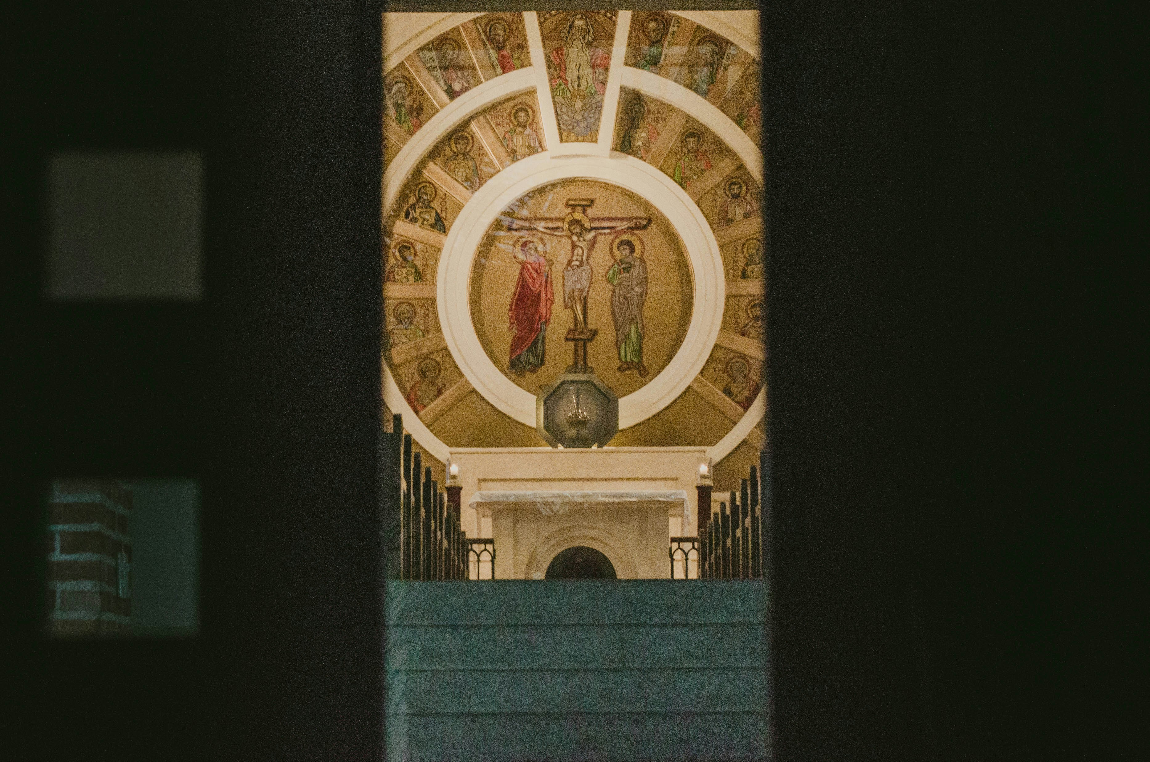 A building with a clock and statues on it