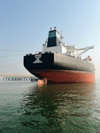 A large boat floating on top of a body of water