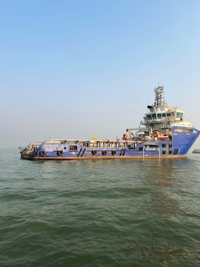 A large boat floating on top of a body of water