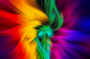 A multicolored flower with a black background