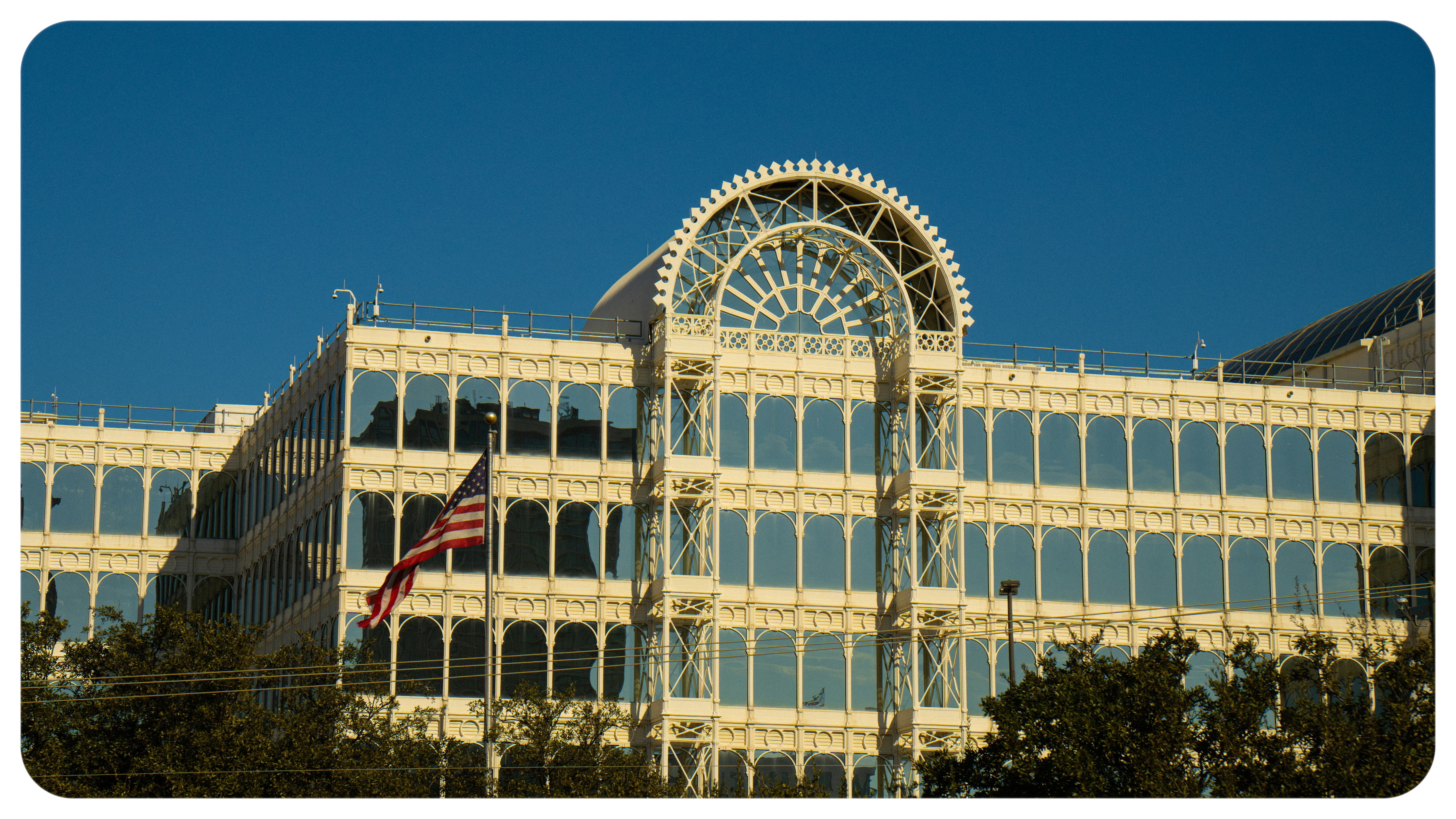 MLB federal courthouse legal investigation - A large building with a flag flying in front of it