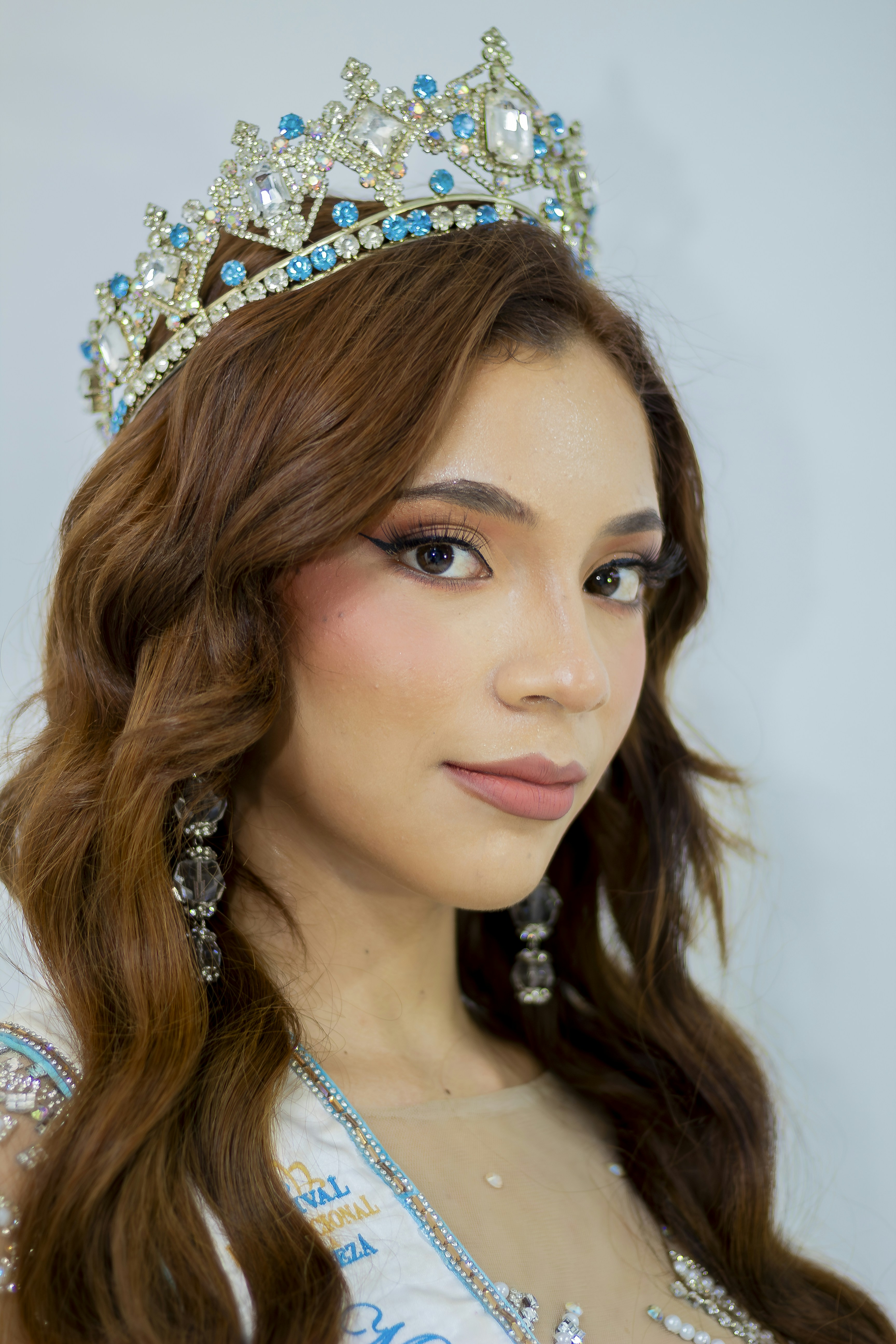 A beautiful young lady wearing a tiara