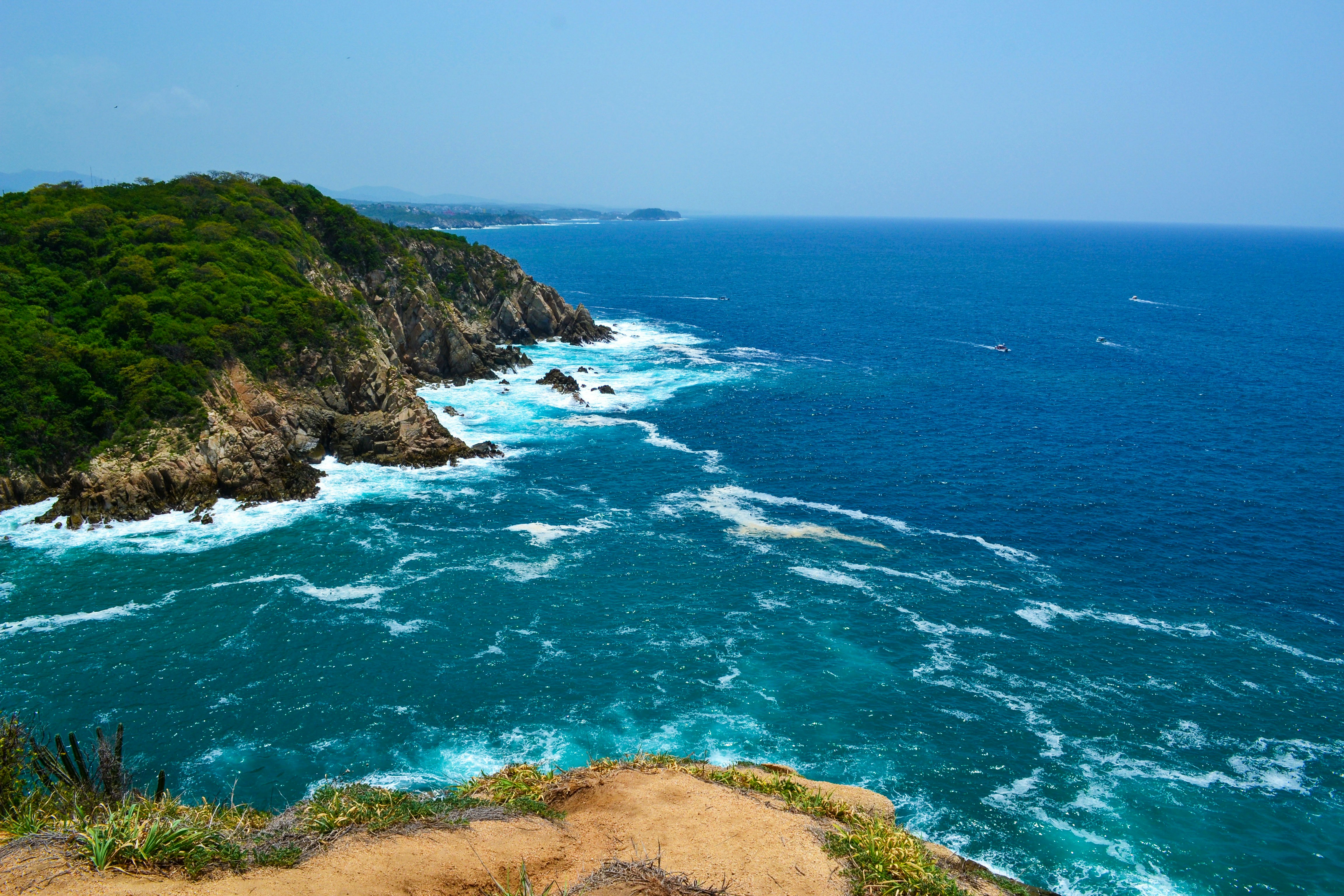 Rocky ocean coastline in Bahías de Huatulco, Oaxaca (cinematic wide view)