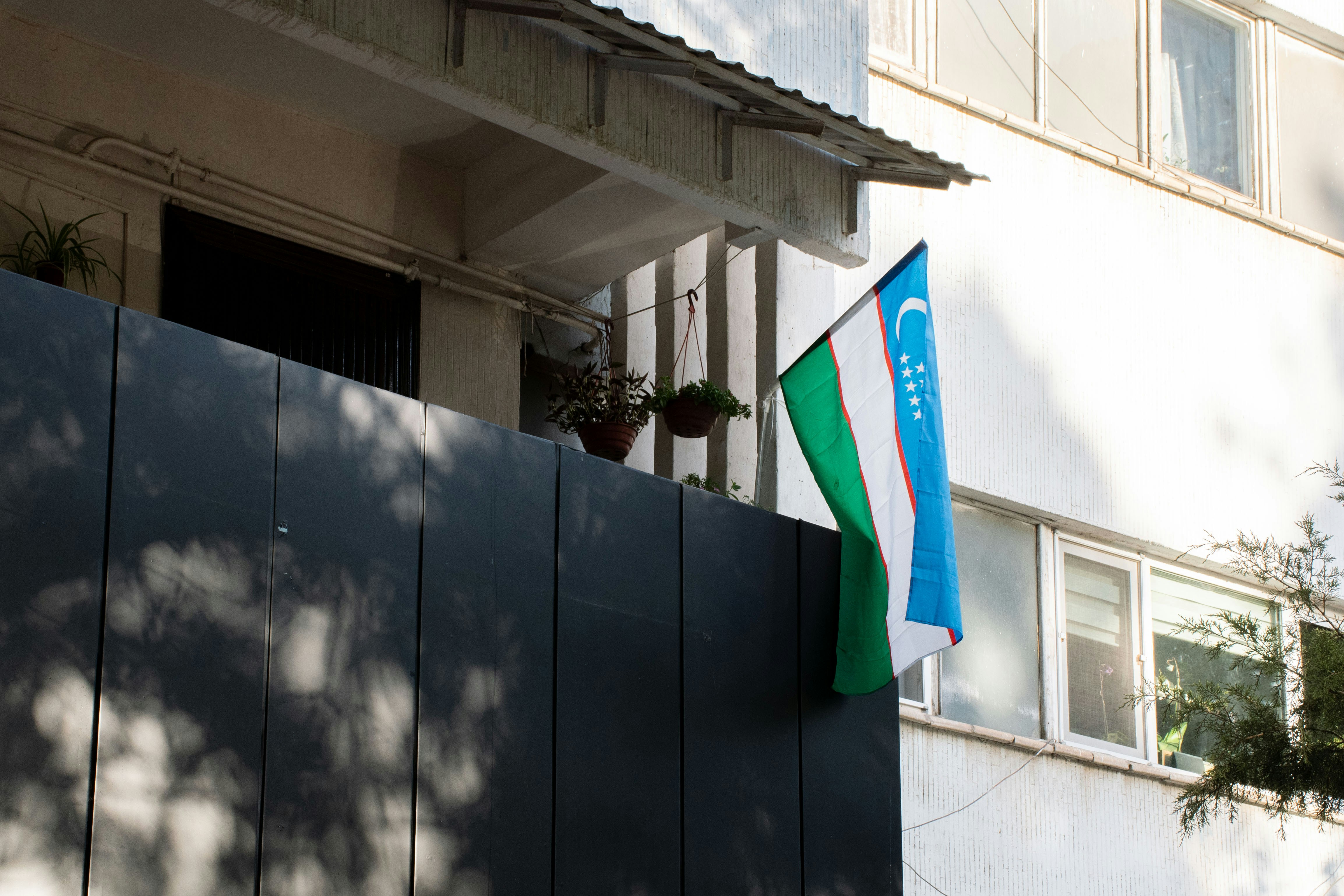 A building with a flag on the outside of it