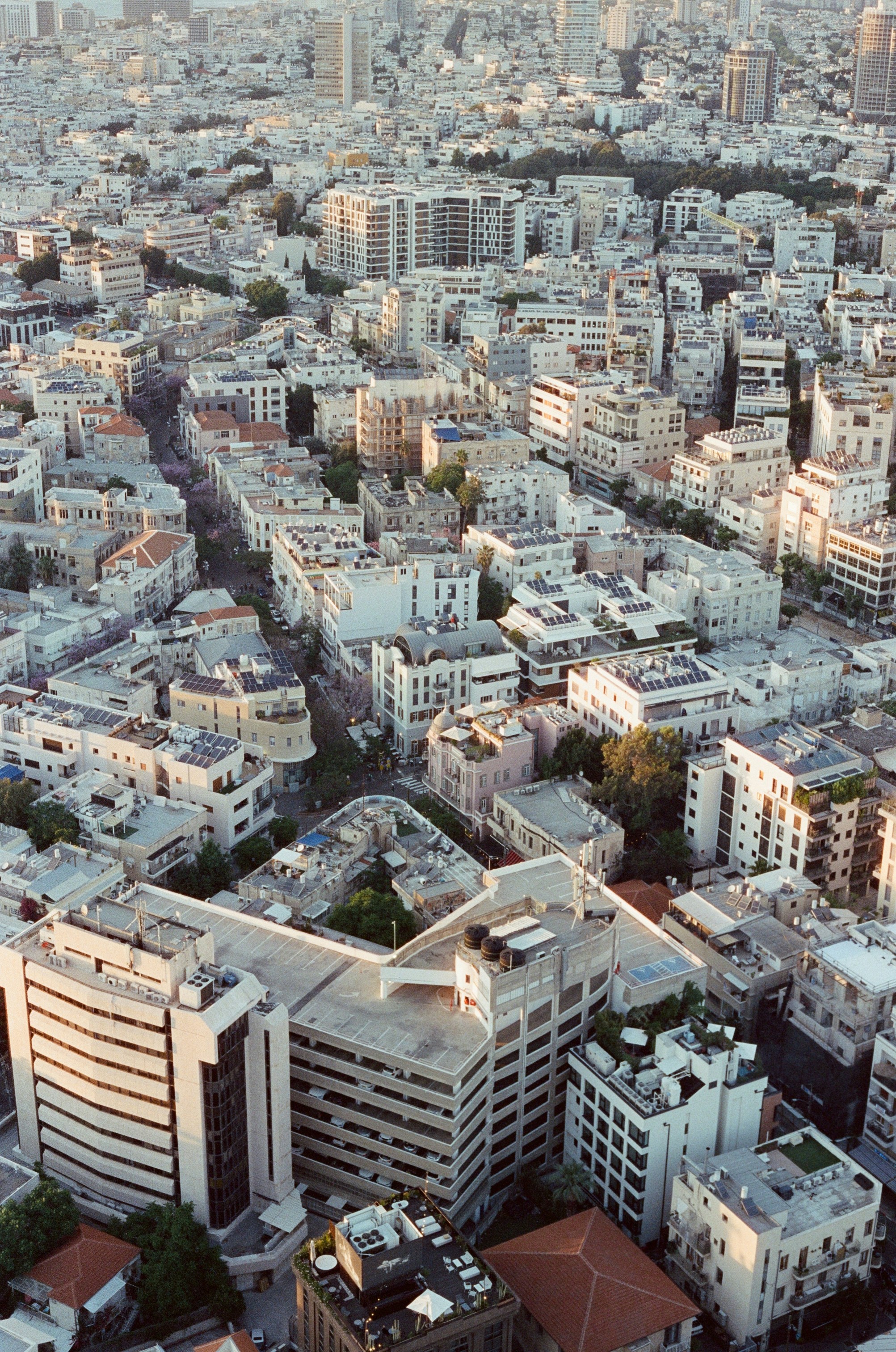 An aerial view of a city with tall buildings