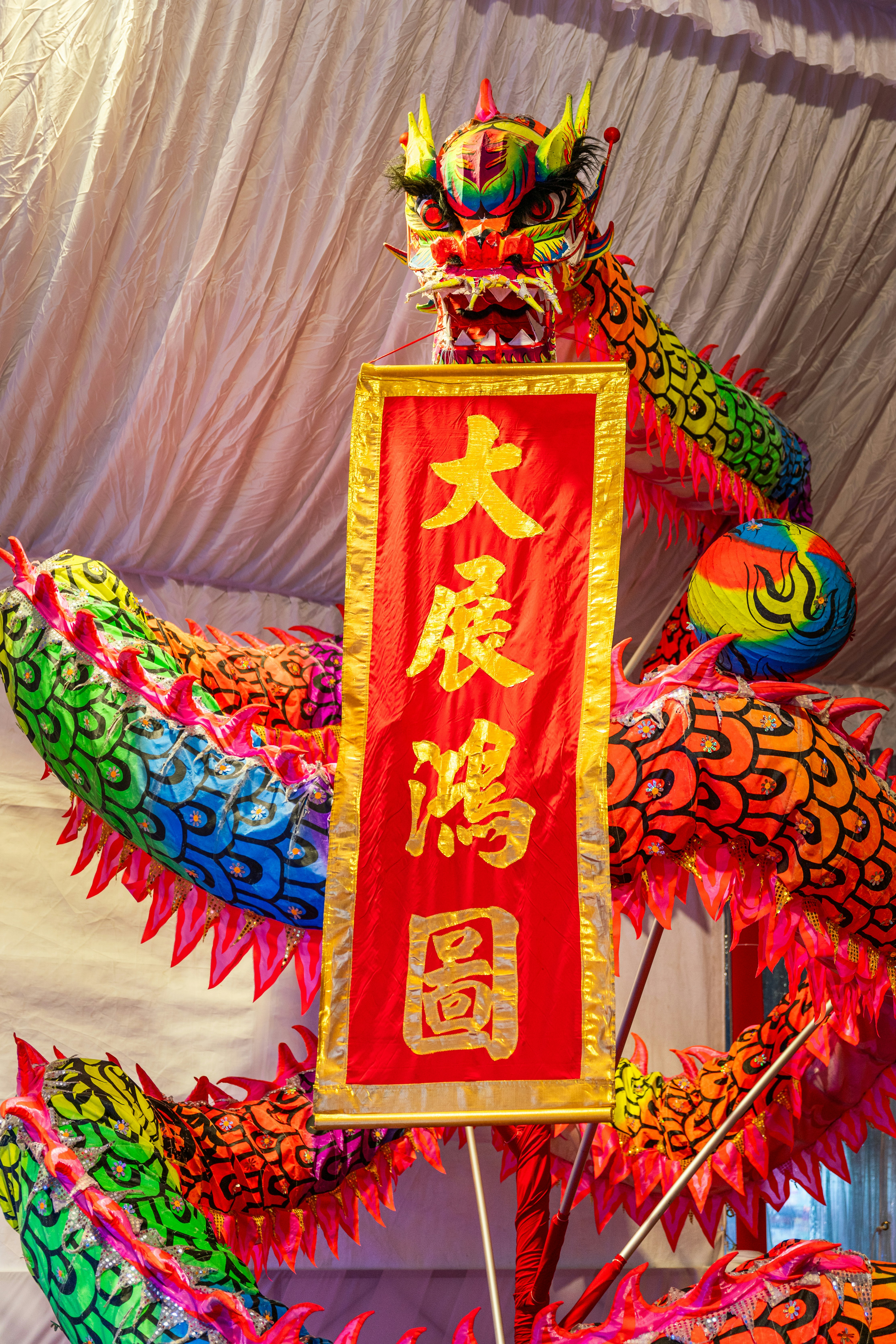 A dragon statue with chinese writing on it