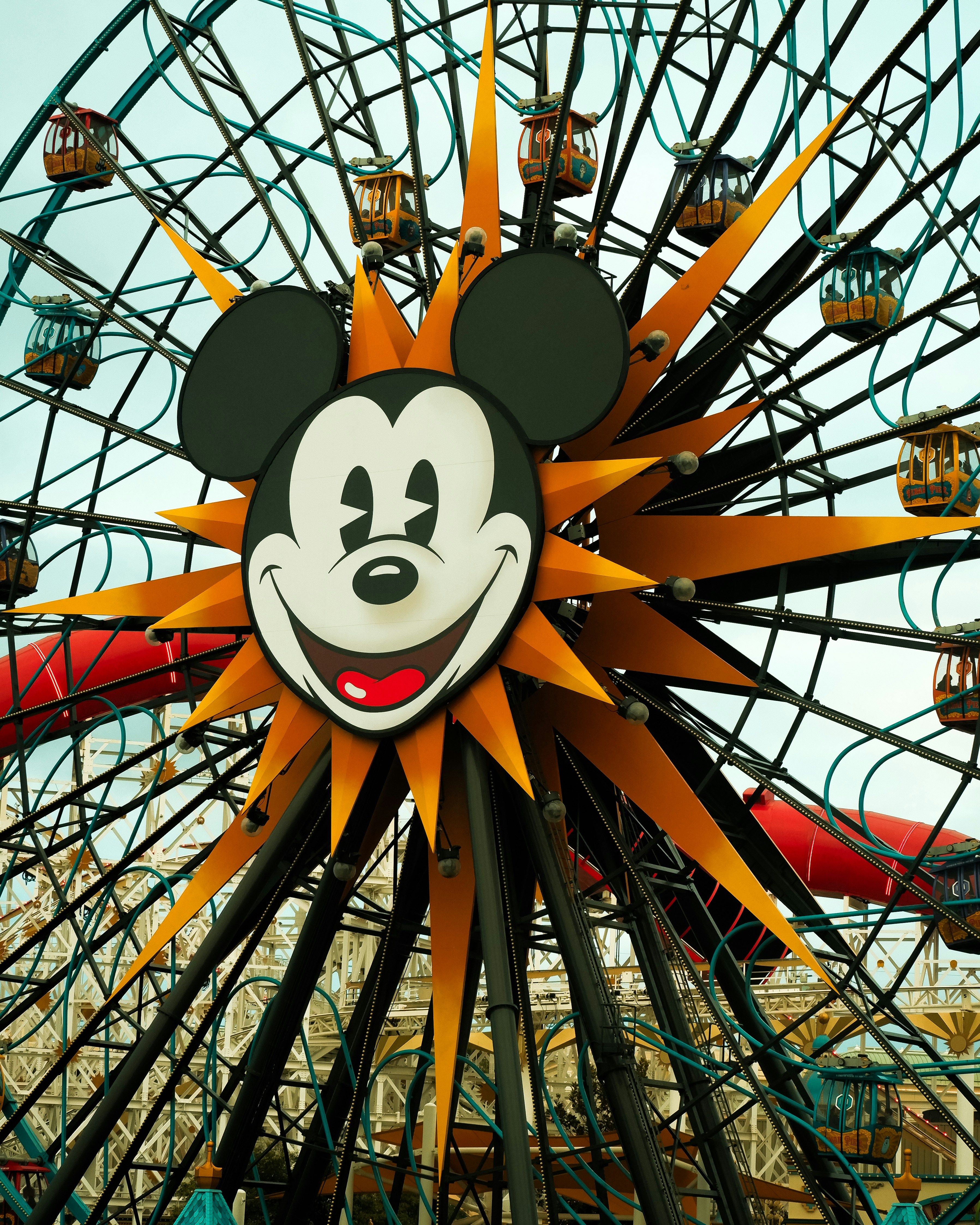 A ferris wheel with a mickey mouse face on it