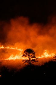 A large fire is burning in the night sky
