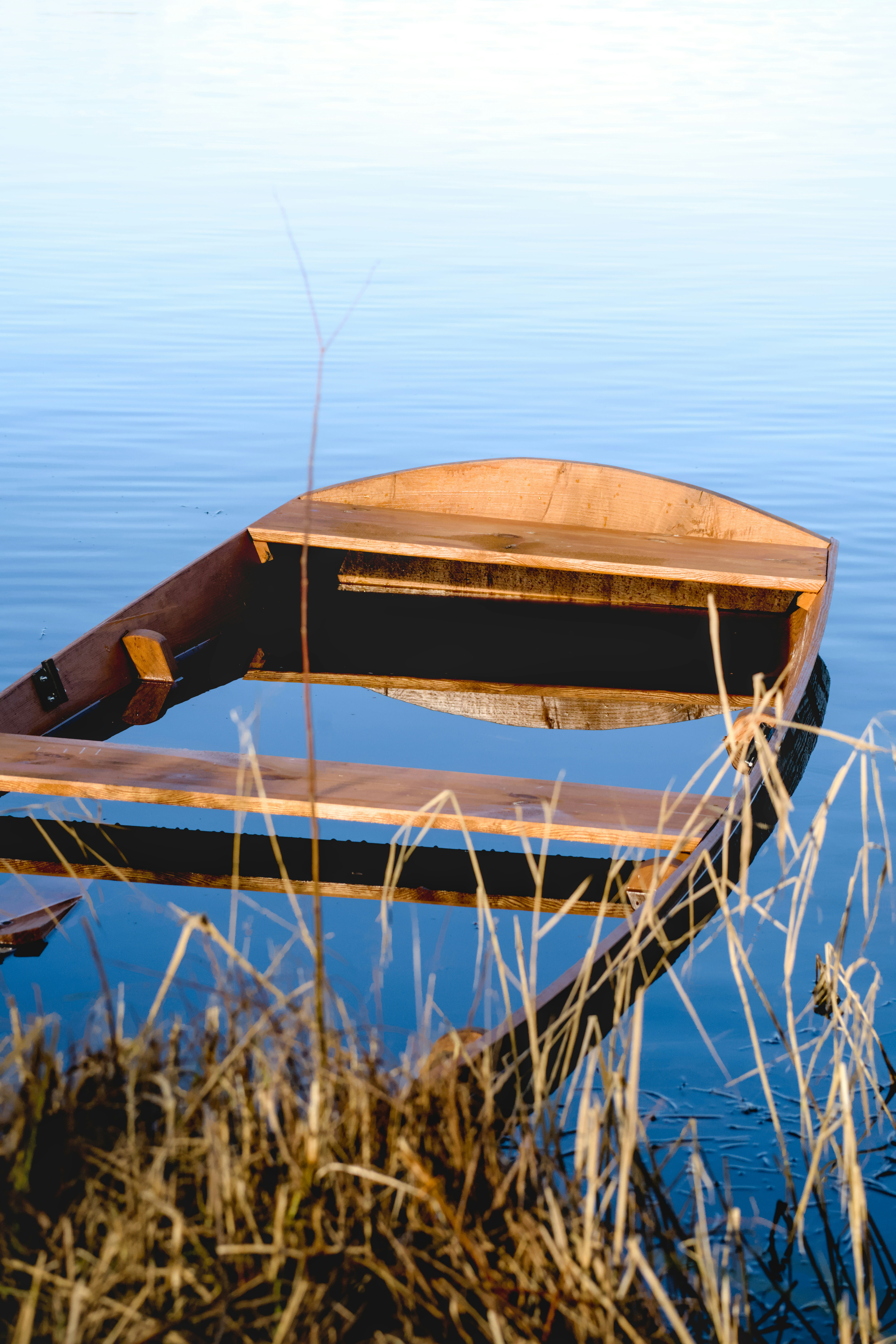 A small boat sitting on top of a body of water