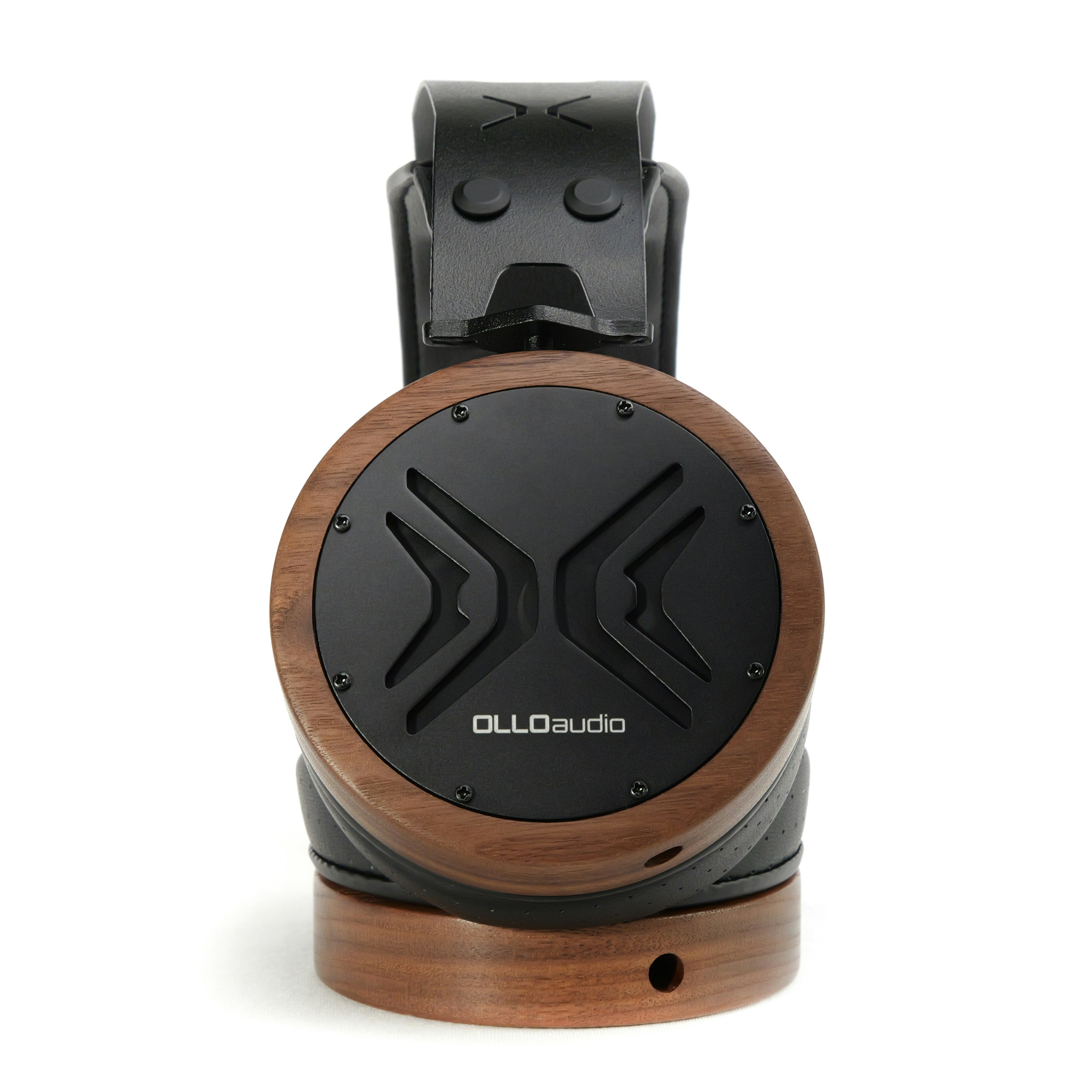 A wooden and black speaker with a wooden stand